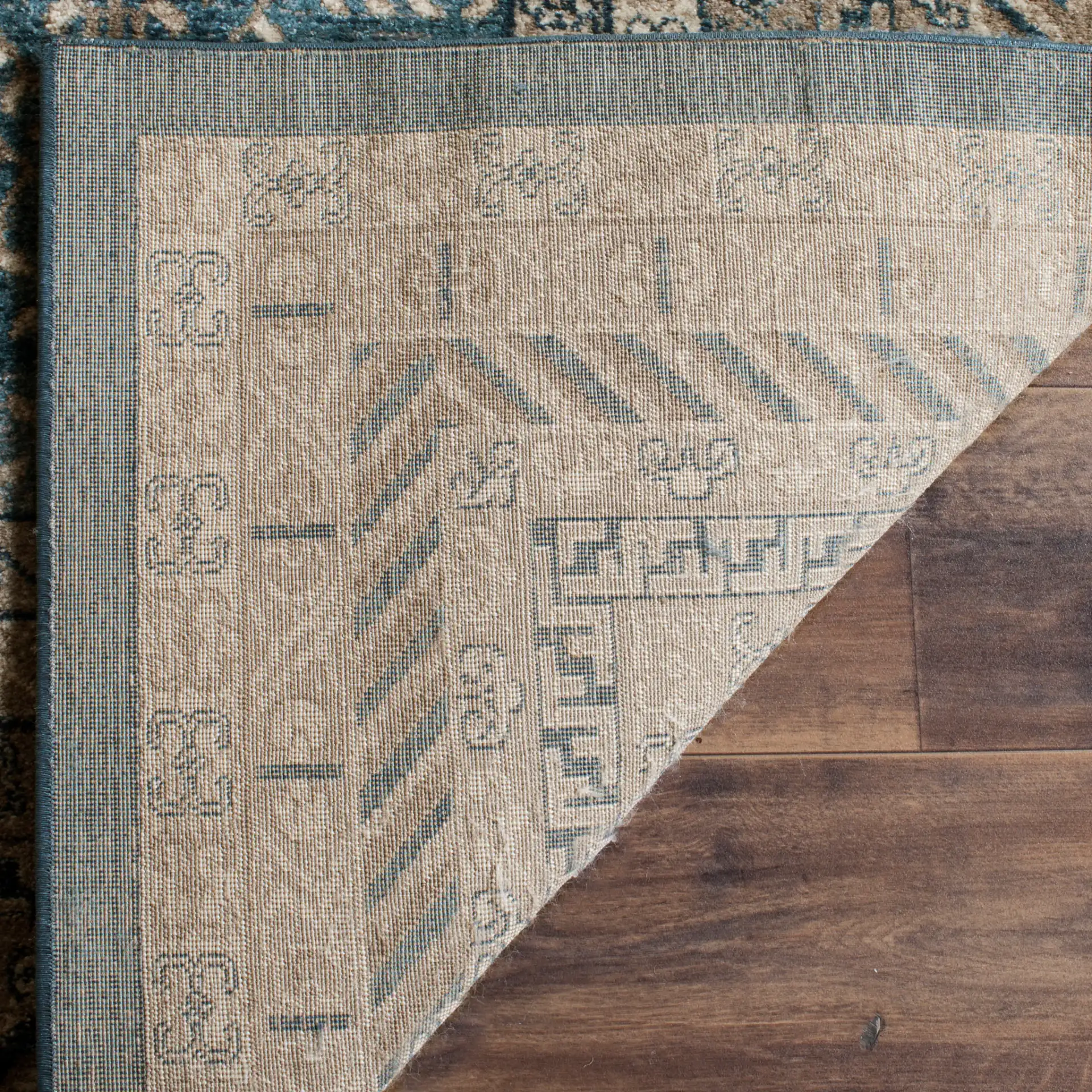 Sofia Bordered Floral Rug in Blue / Beige in a styled room