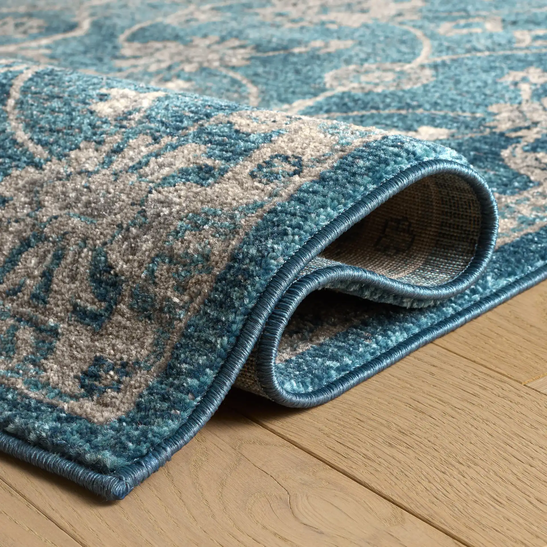 Sofia Floral Vine Rug in Blue / Beige in a styled room