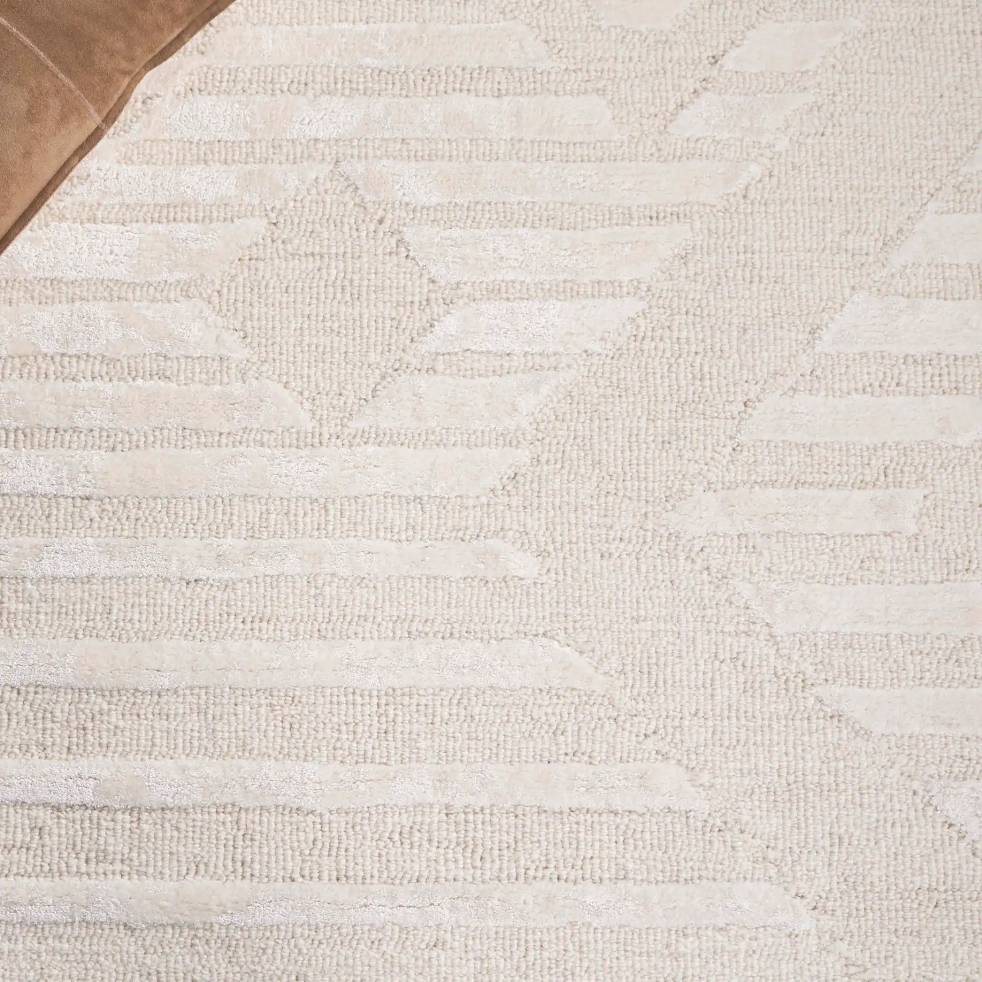 Soho Striped Diamond Hand-Tufted Rug in Ivory in a styled room