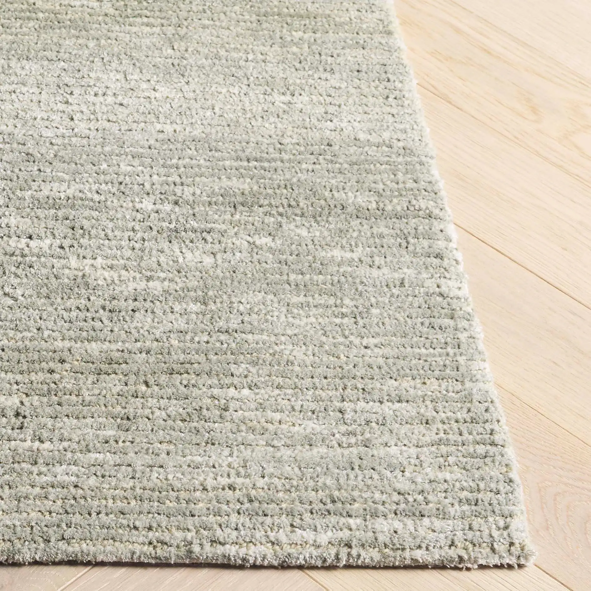 Soho Ribbed Hand-Tufted Rug in Green in a styled room