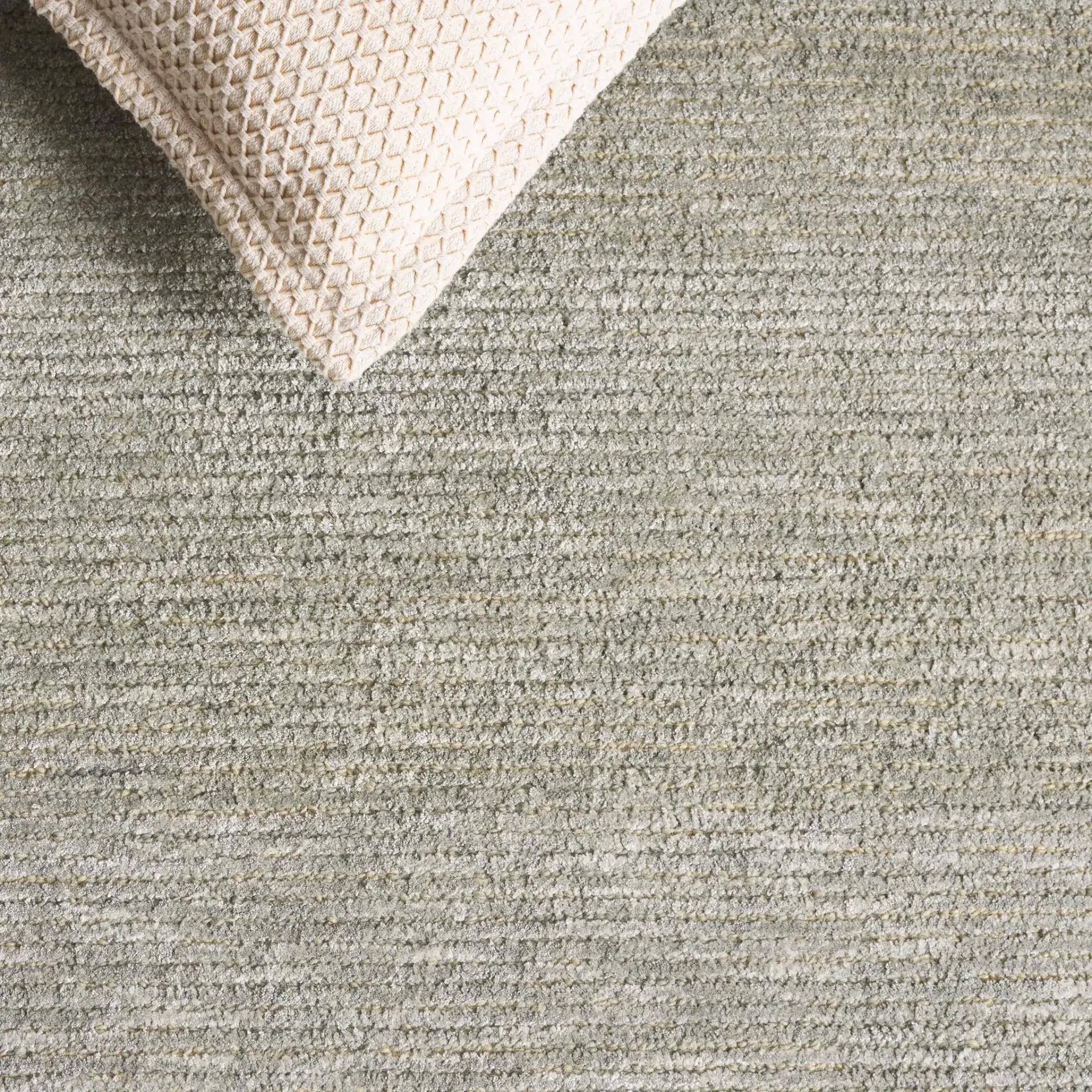 Soho Ribbed Hand-Tufted Rug in Green in a styled room
