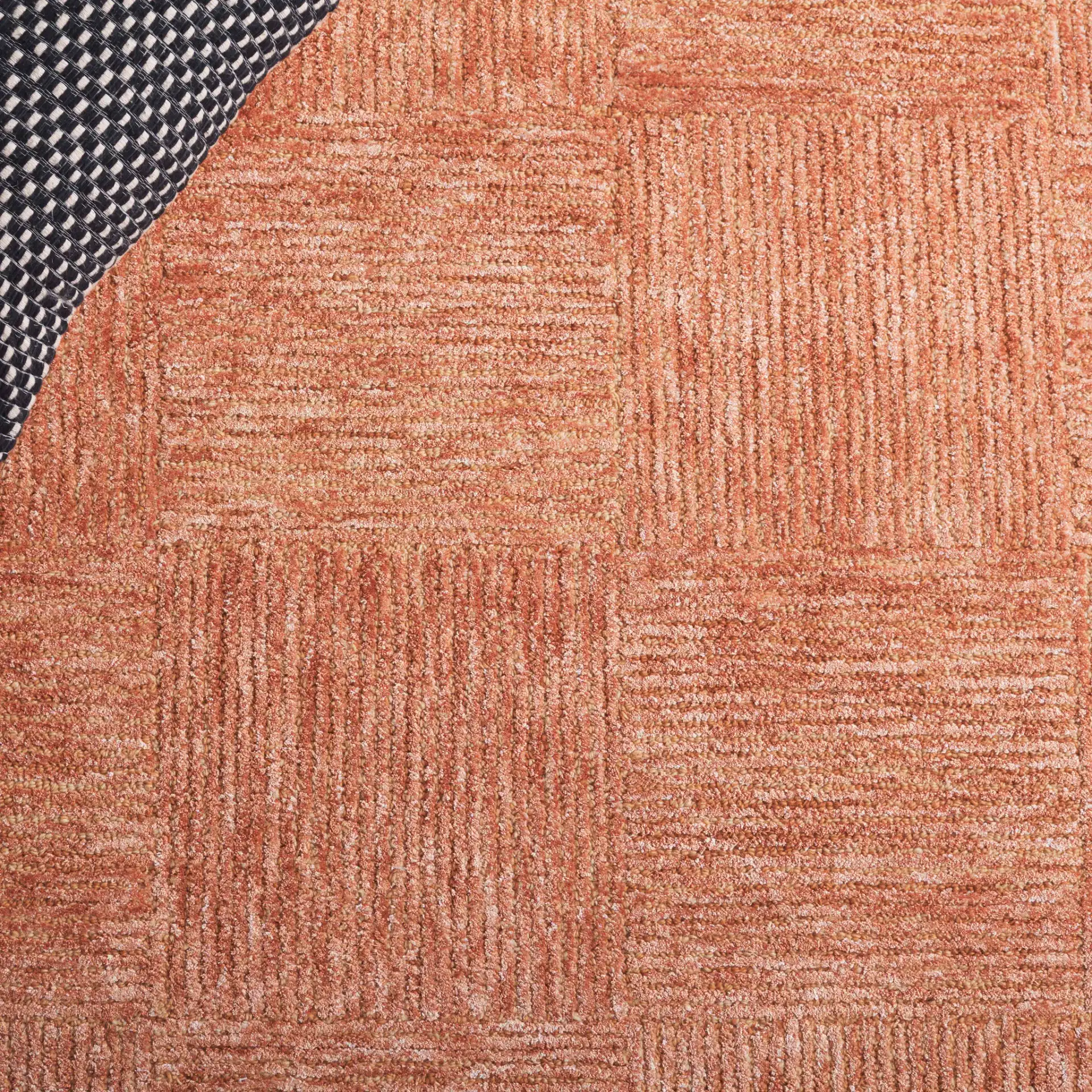 Soho Checkerboard Hand-Tufted Rug in Rust in a styled room