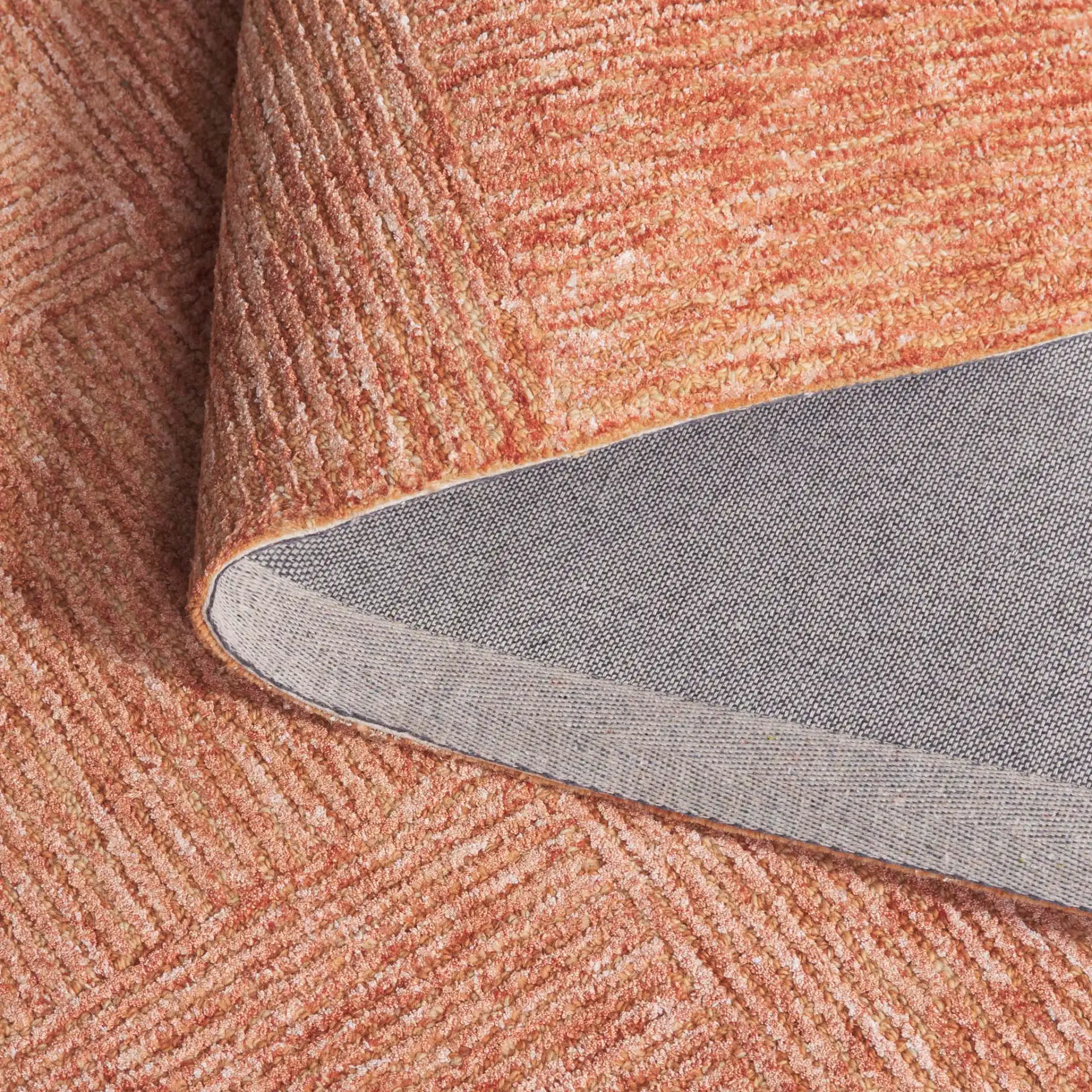 Soho Checkerboard Hand-Tufted Rug in Rust in a styled room