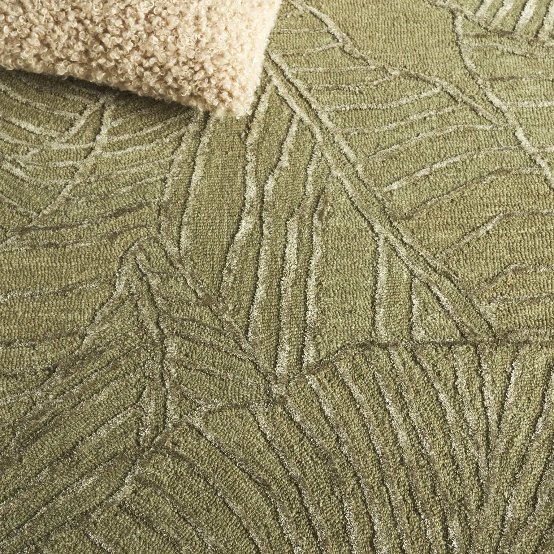 Soho Tropical Leaf Hand-Tufted Rug in Green in a styled room