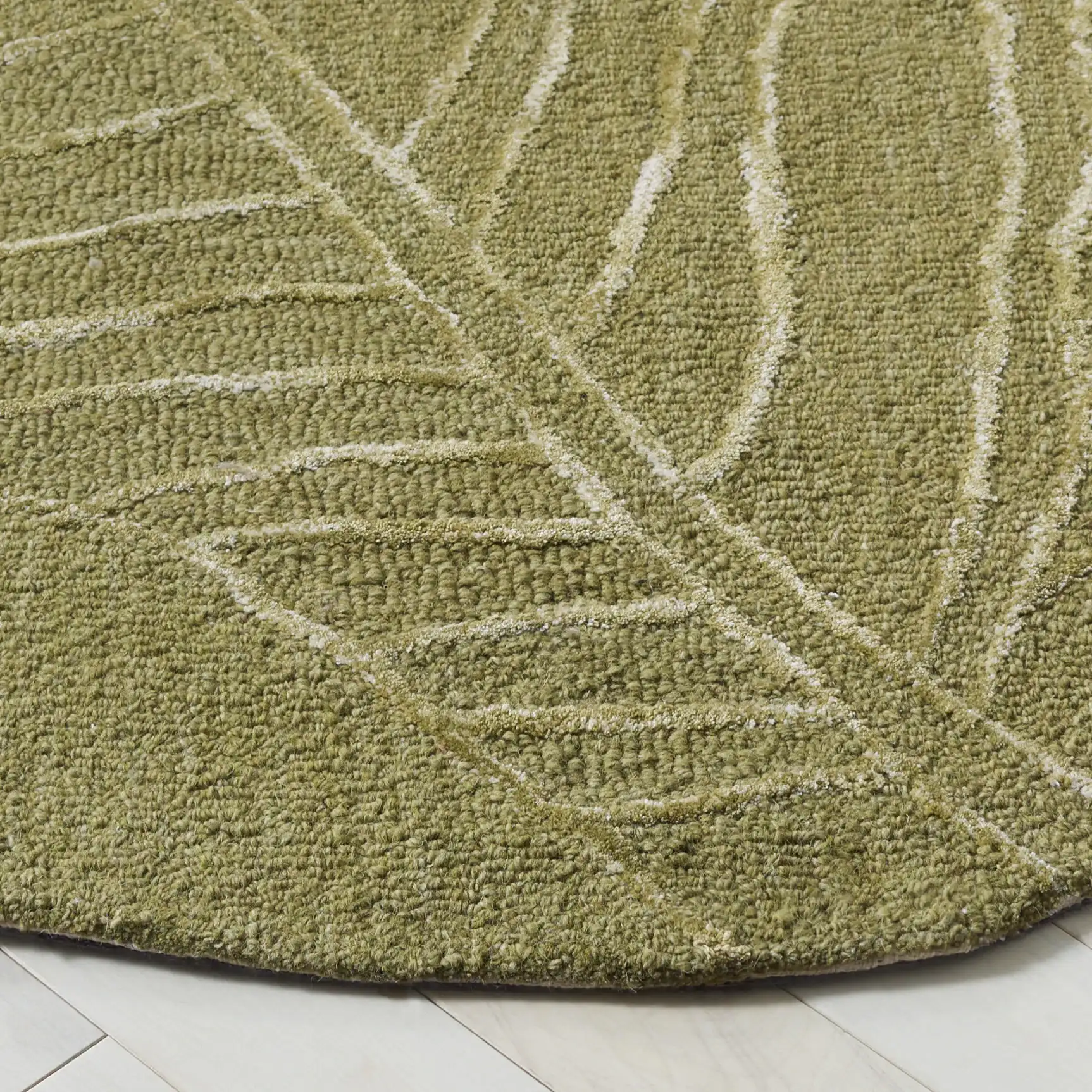 Soho Tropical Leaf Hand-Tufted Rug in Green in a styled room
