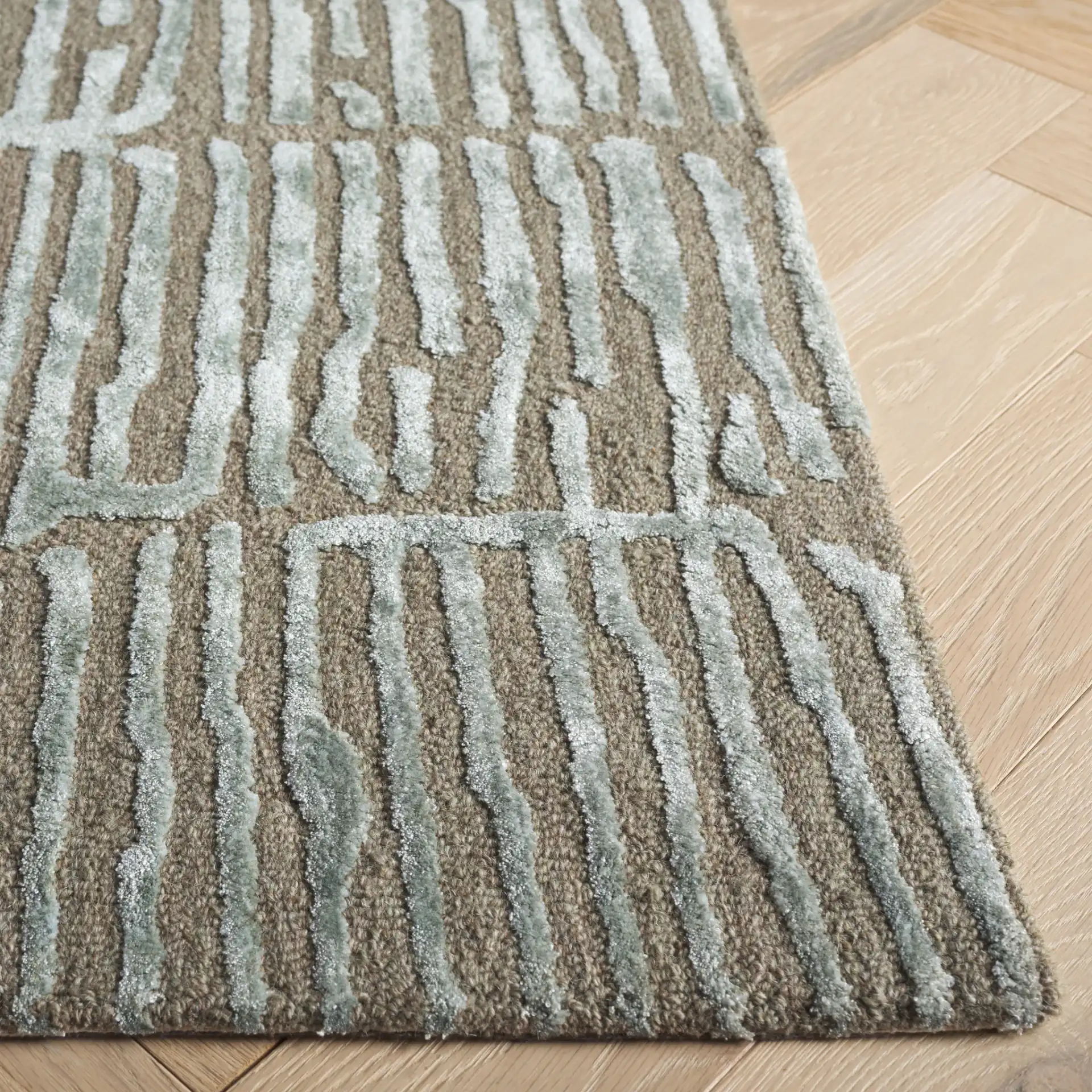 Soho Linear Abstract Hand-Tufted Rug in Green / Brown in a styled room