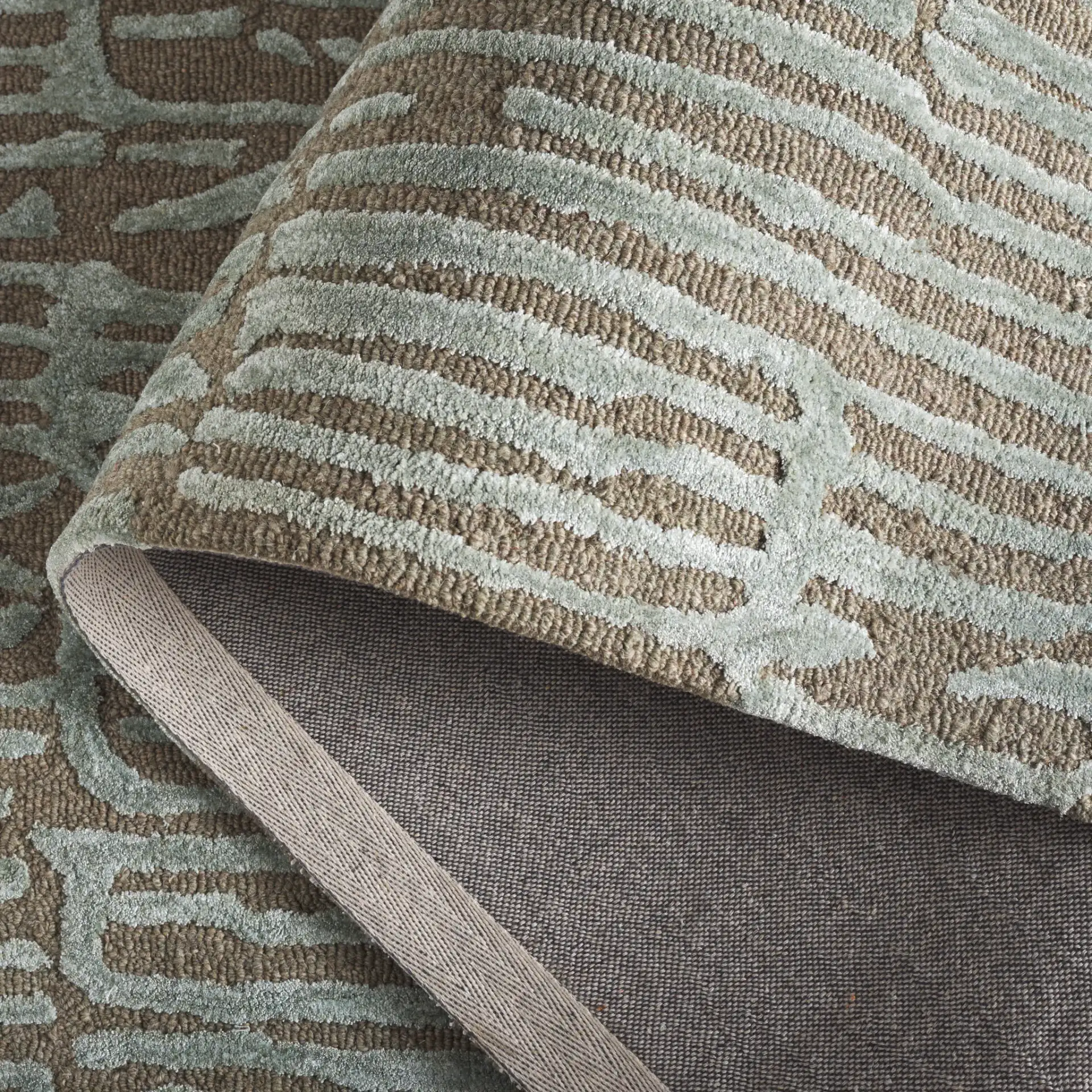 Soho Linear Abstract Hand-Tufted Rug in Green / Brown in a styled room