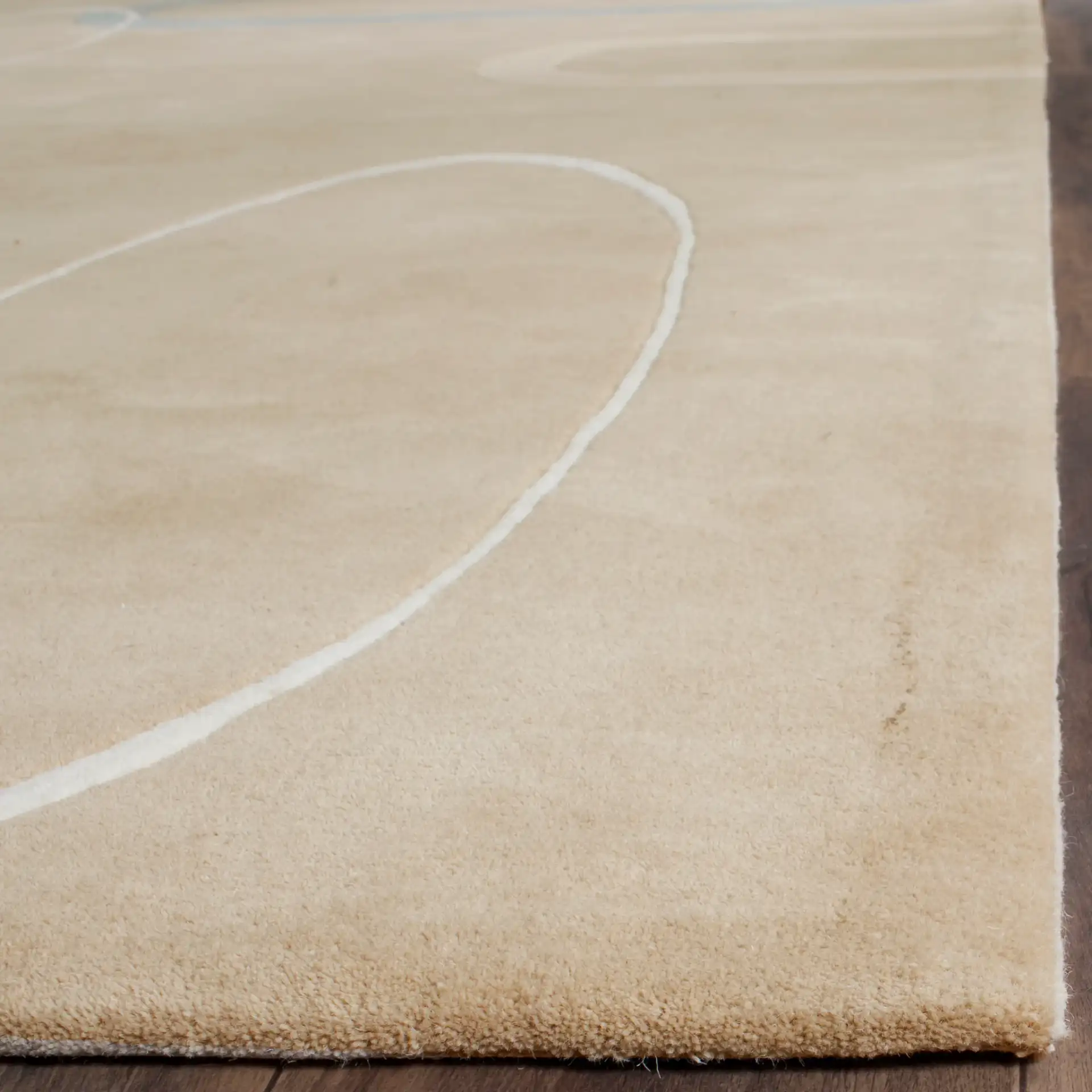 Soho Retro Loop Hand-Tufted Wool Rug in Beige in a styled room
