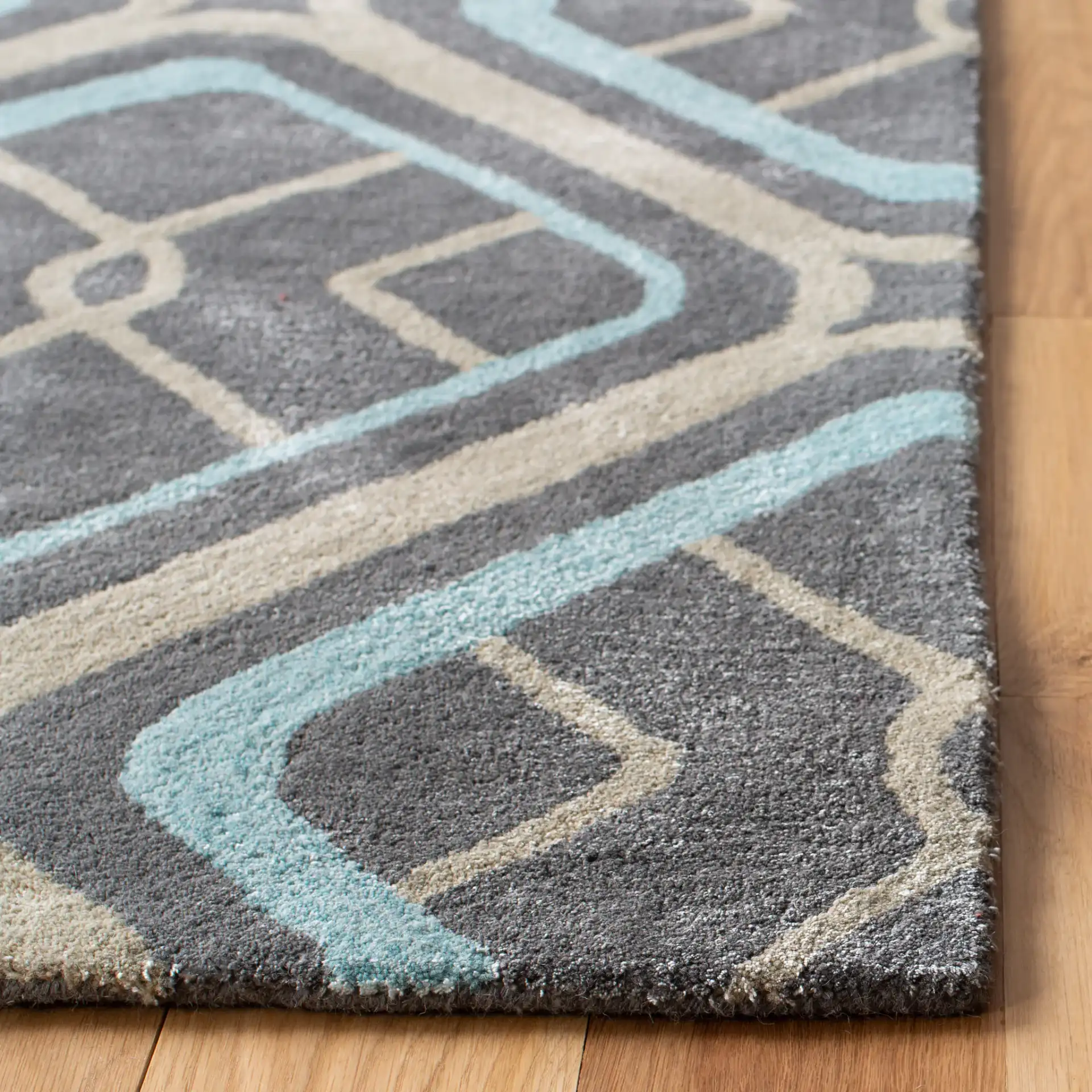 Soho Interlocking Diamond Hand-Tufted Rug in Gray / Multicolor in a styled room