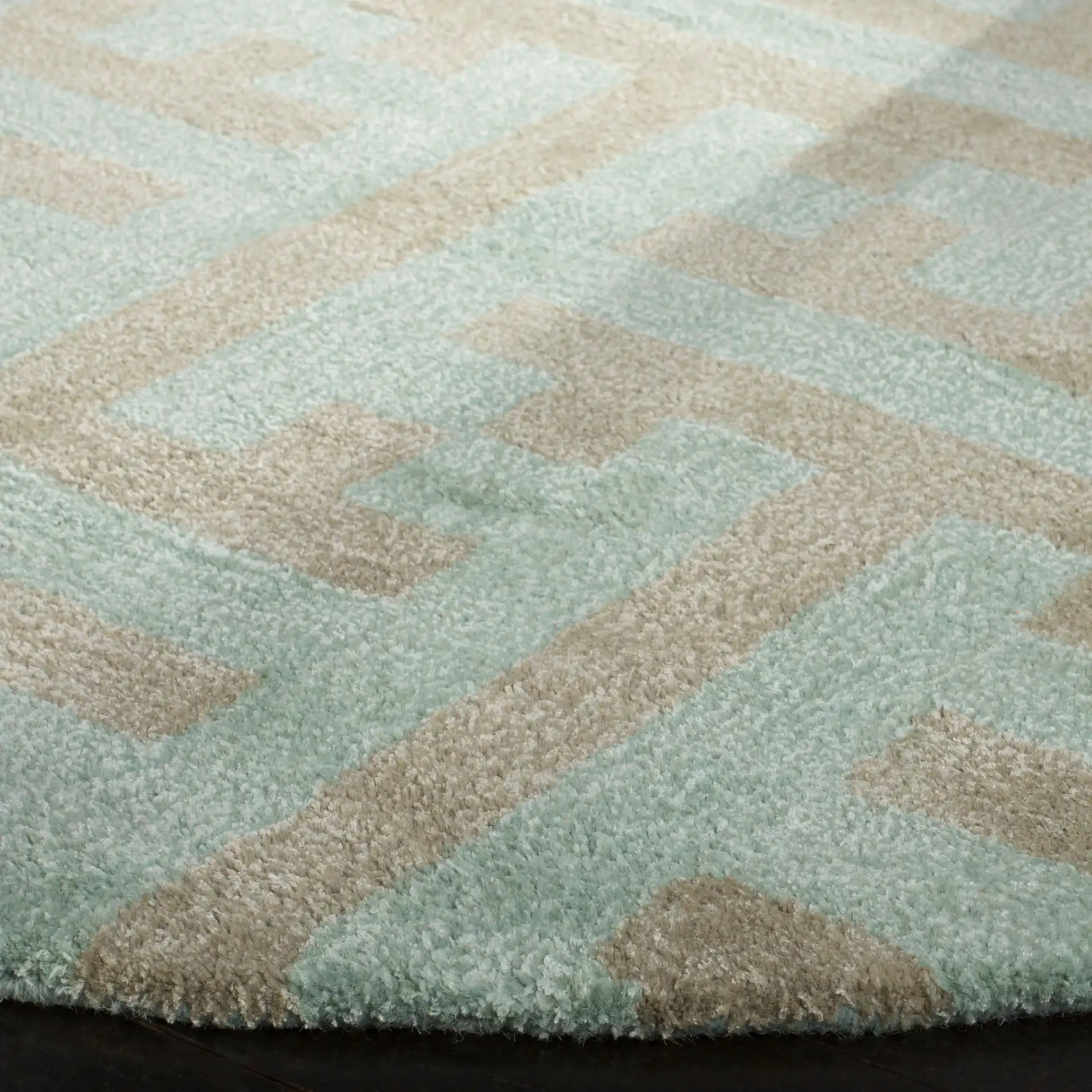 Soho Interlocking Maze Hand-Tufted Rug in Light Blue / Multicolor in a styled room