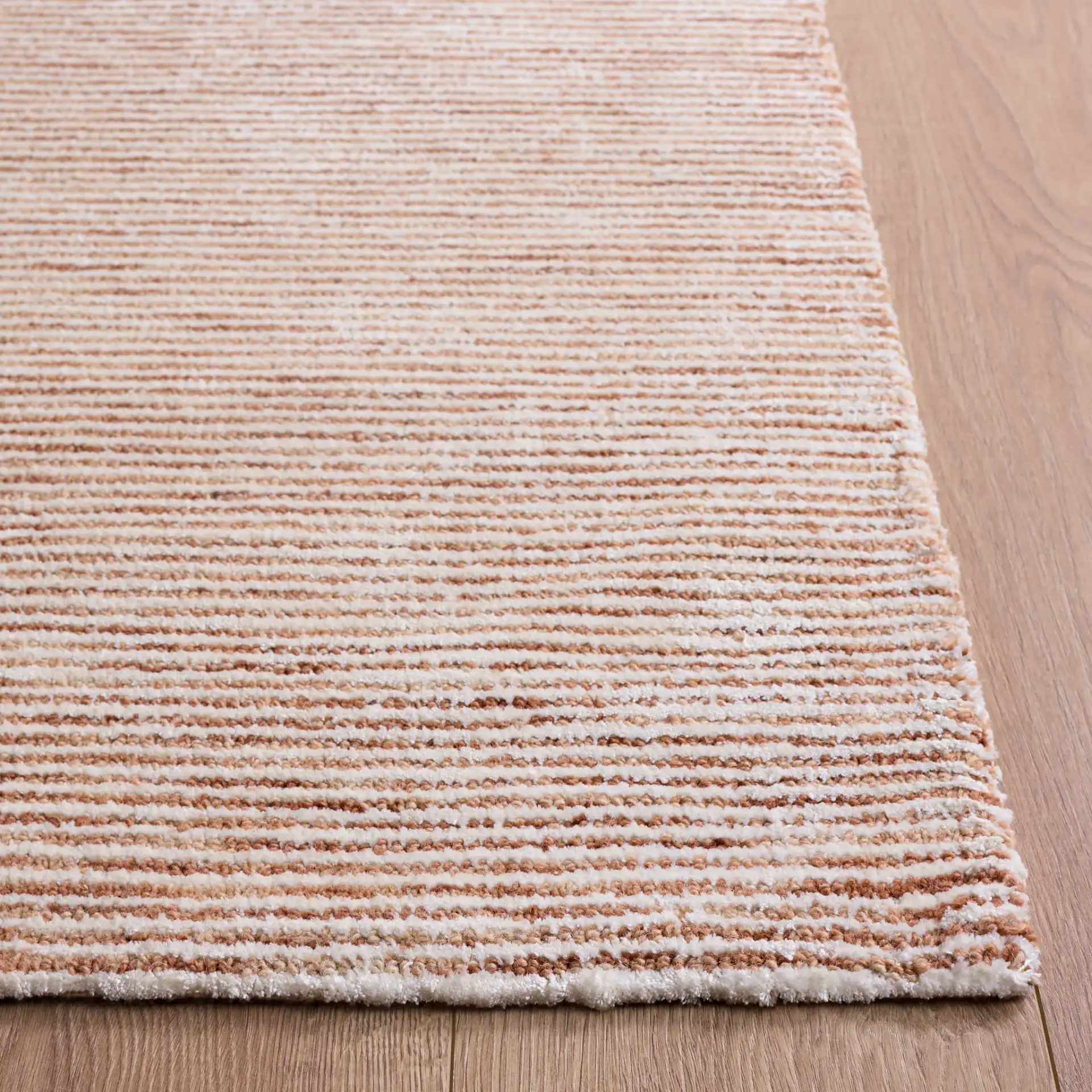 Soho Ribbed Hand-Tufted Rug in Rust in a styled room