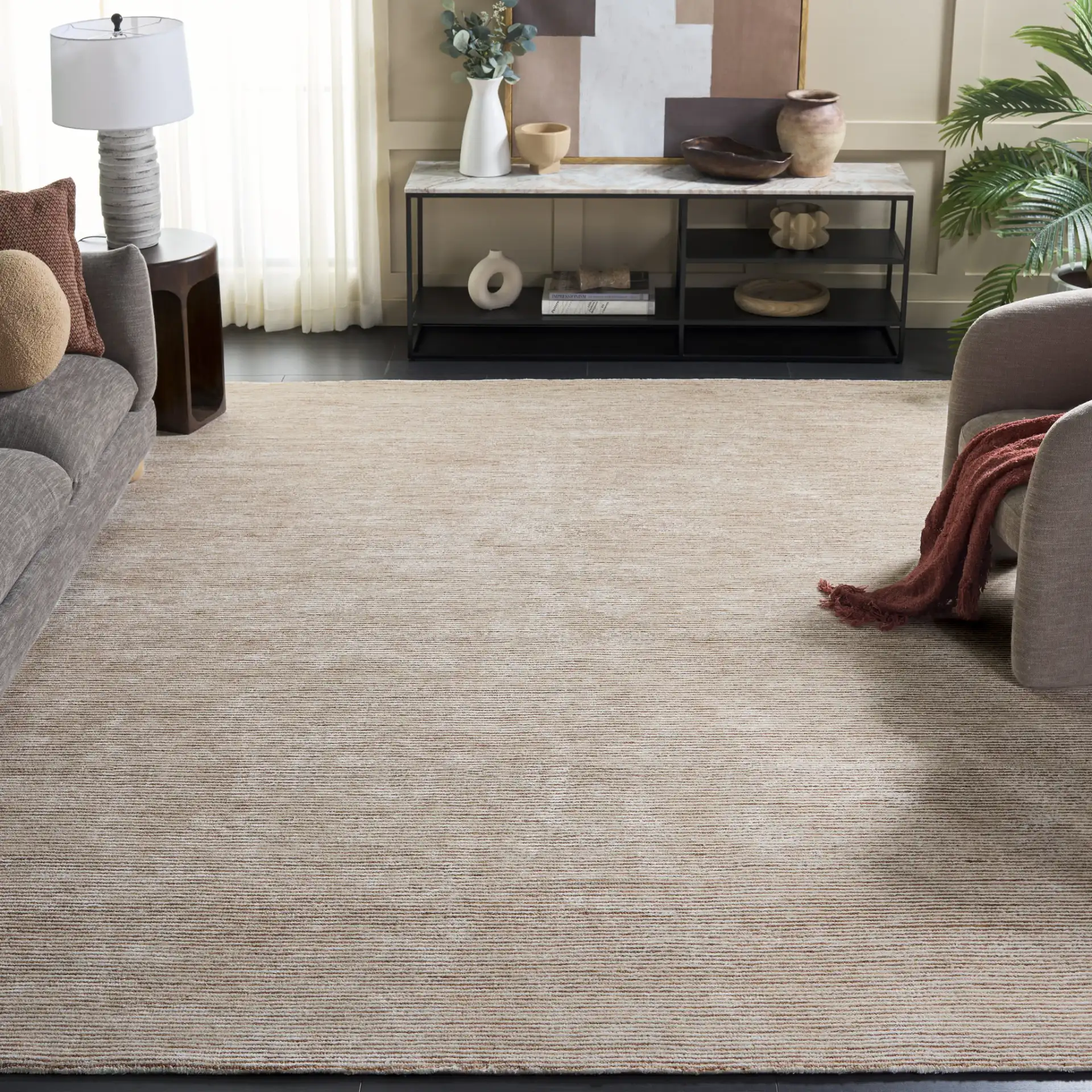 Soho Ribbed Hand-Tufted Rug in Rust in a styled room