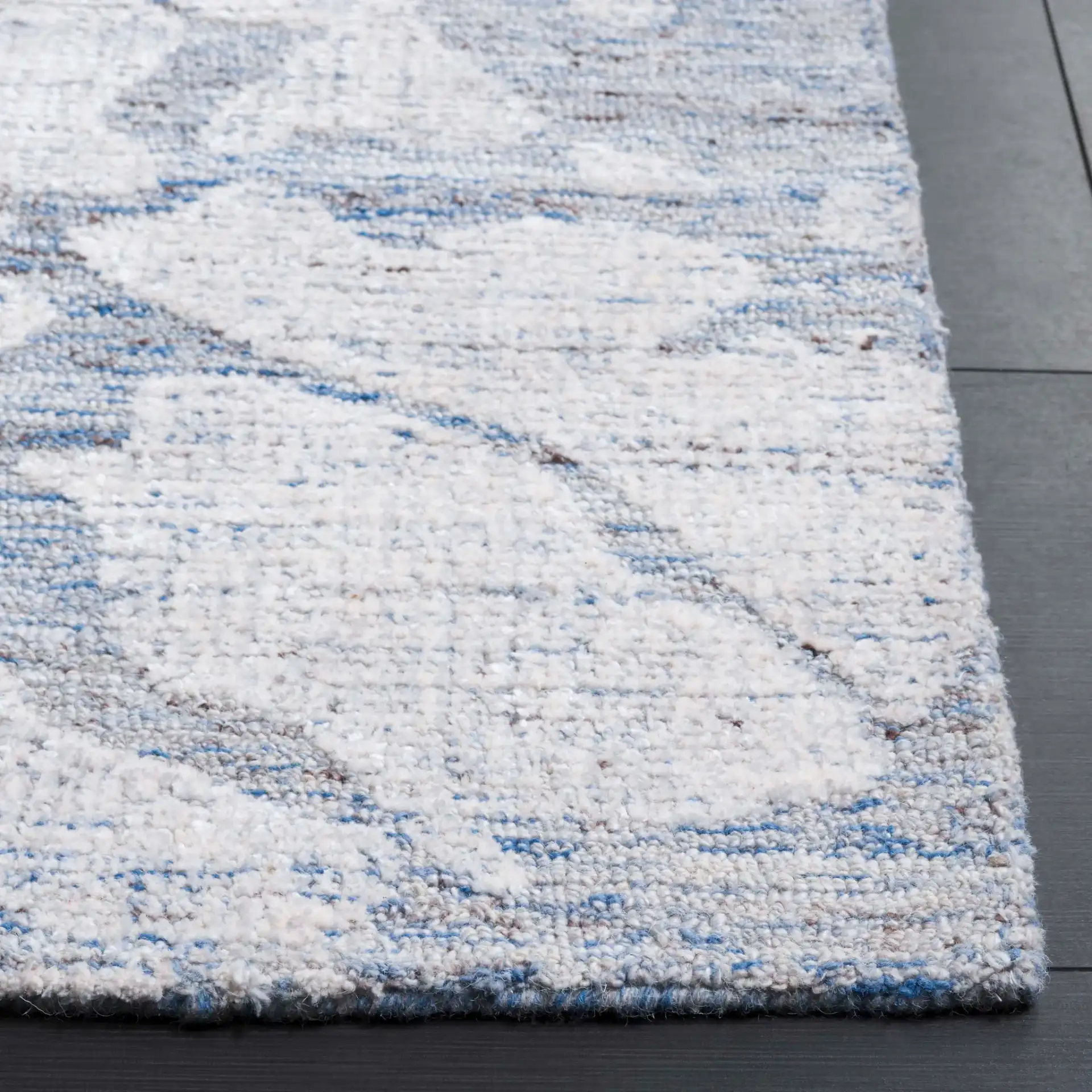 Soho Abstract Pebble Hand-Tufted Rug in Blue / Ivory in a styled room