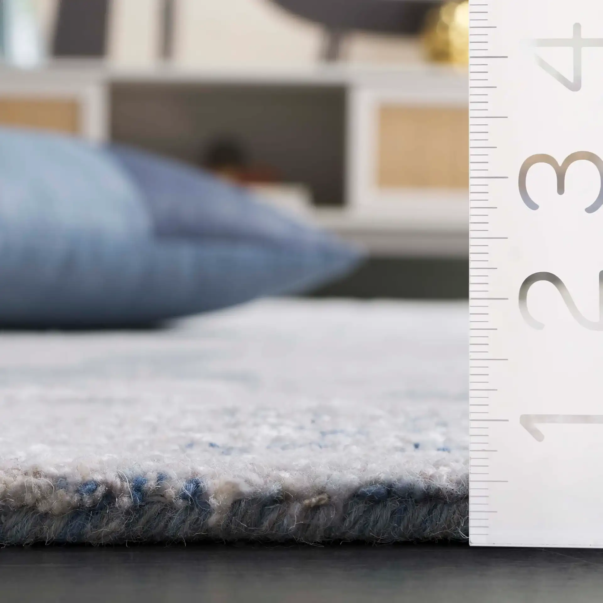 Soho Abstract Pebble Hand-Tufted Rug in Blue / Ivory in a styled room