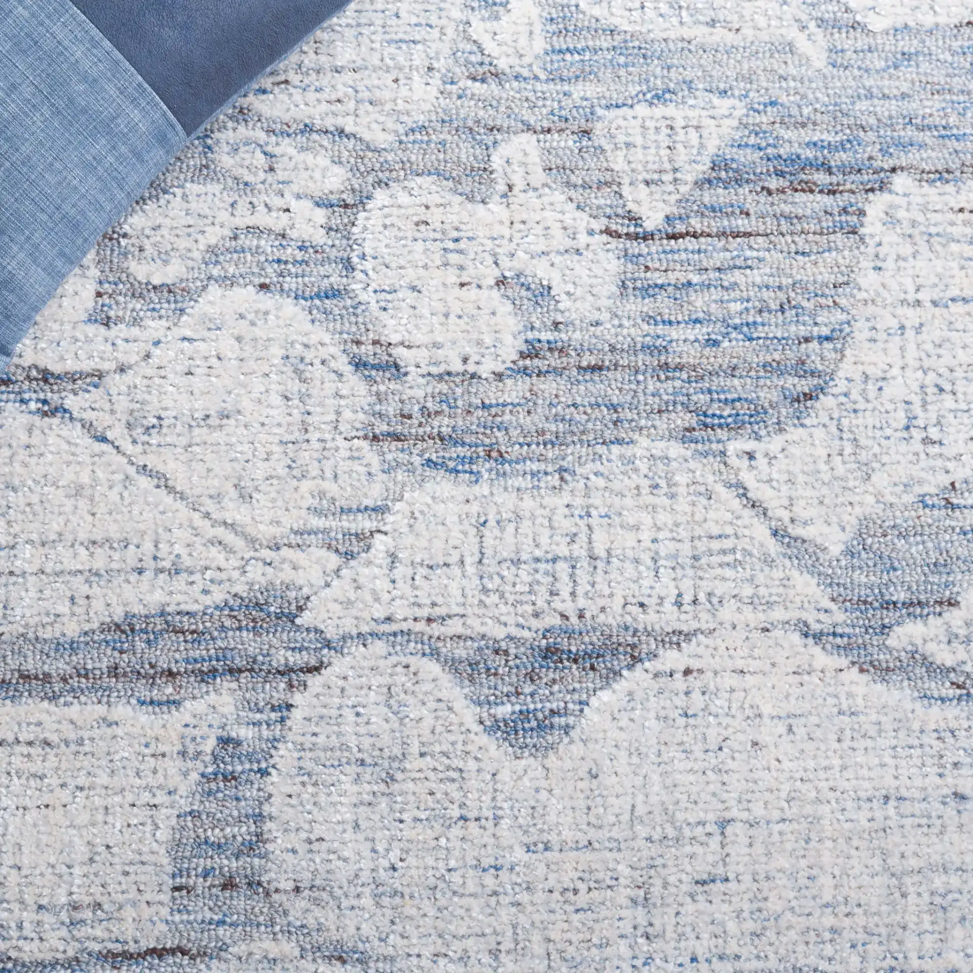 Soho Abstract Pebble Hand-Tufted Rug in Blue / Ivory in a styled room
