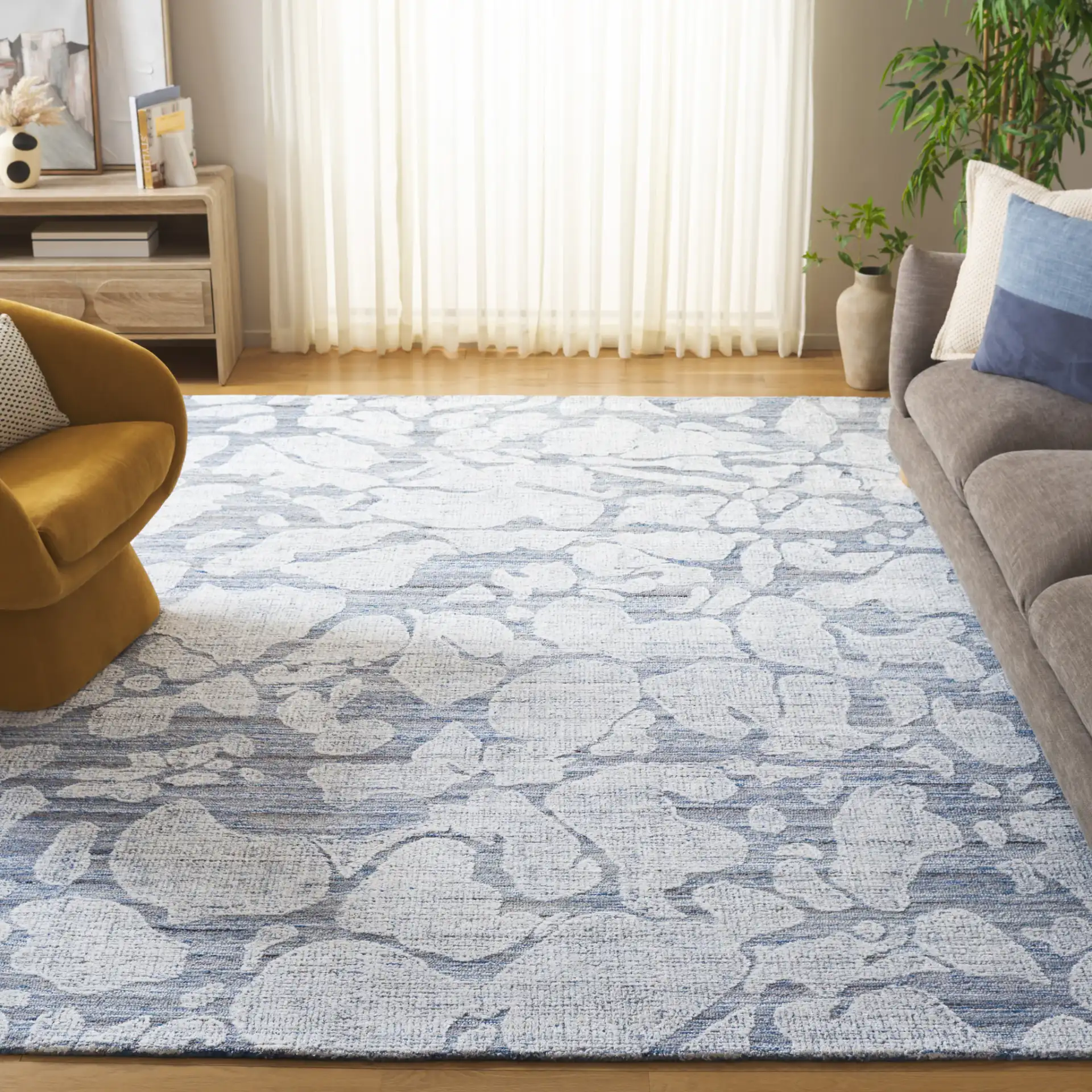Soho Abstract Pebble Hand-Tufted Rug in Blue / Ivory in a styled room