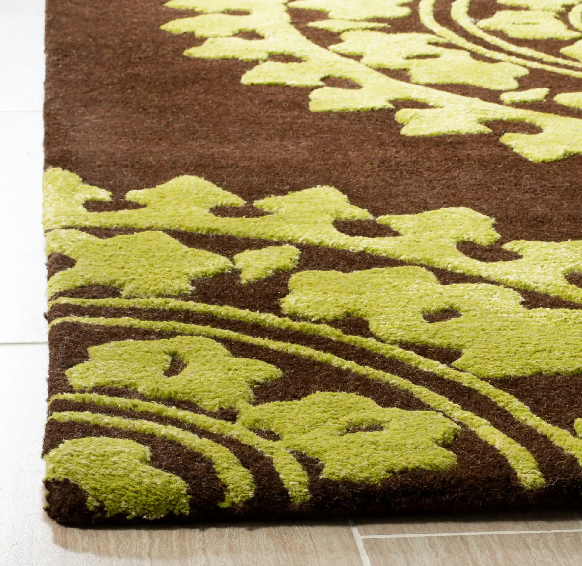Soho Sunburst Medallion Hand-Tufted Rug in Brown / Green in a styled room