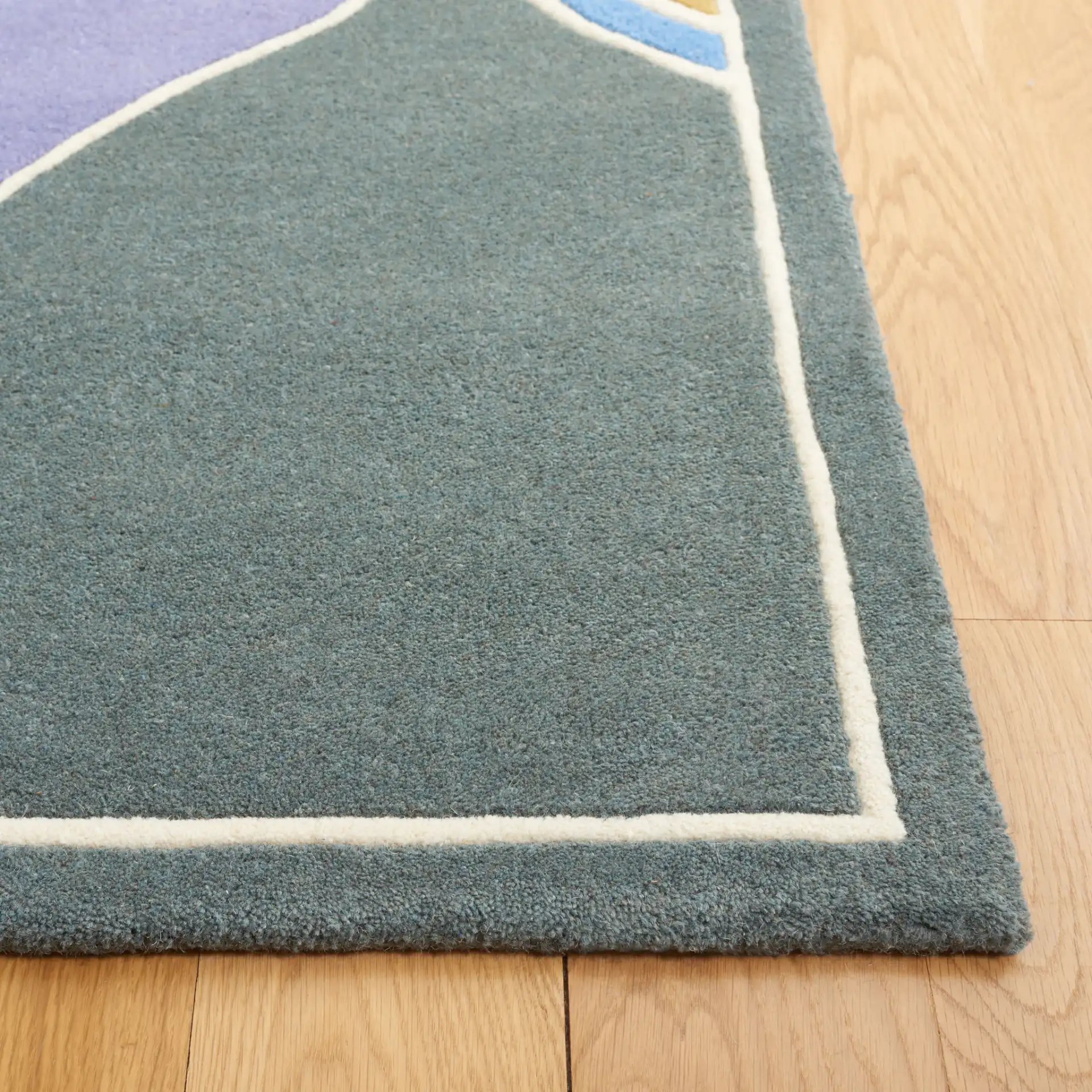 Soho Interlocking Waves Hand-Tufted Rug in Multicolor in a styled room