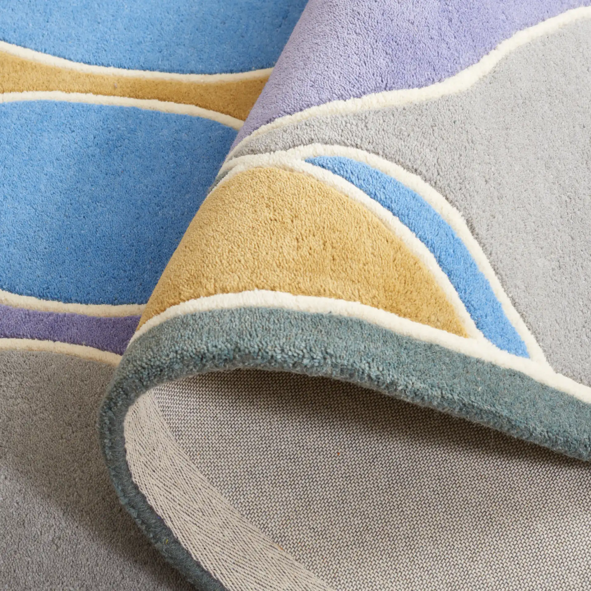 Soho Interlocking Waves Hand-Tufted Rug in Multicolor in a styled room