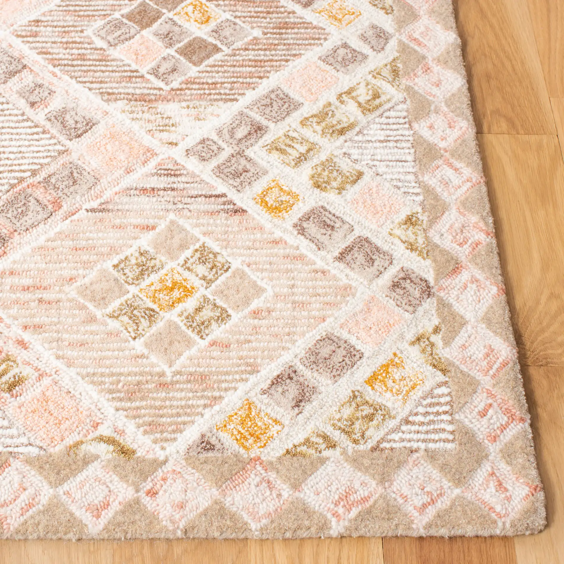 Soho Diamond Lattice Hand-Tufted Wool Rug in Pink / Taupe in a styled room
