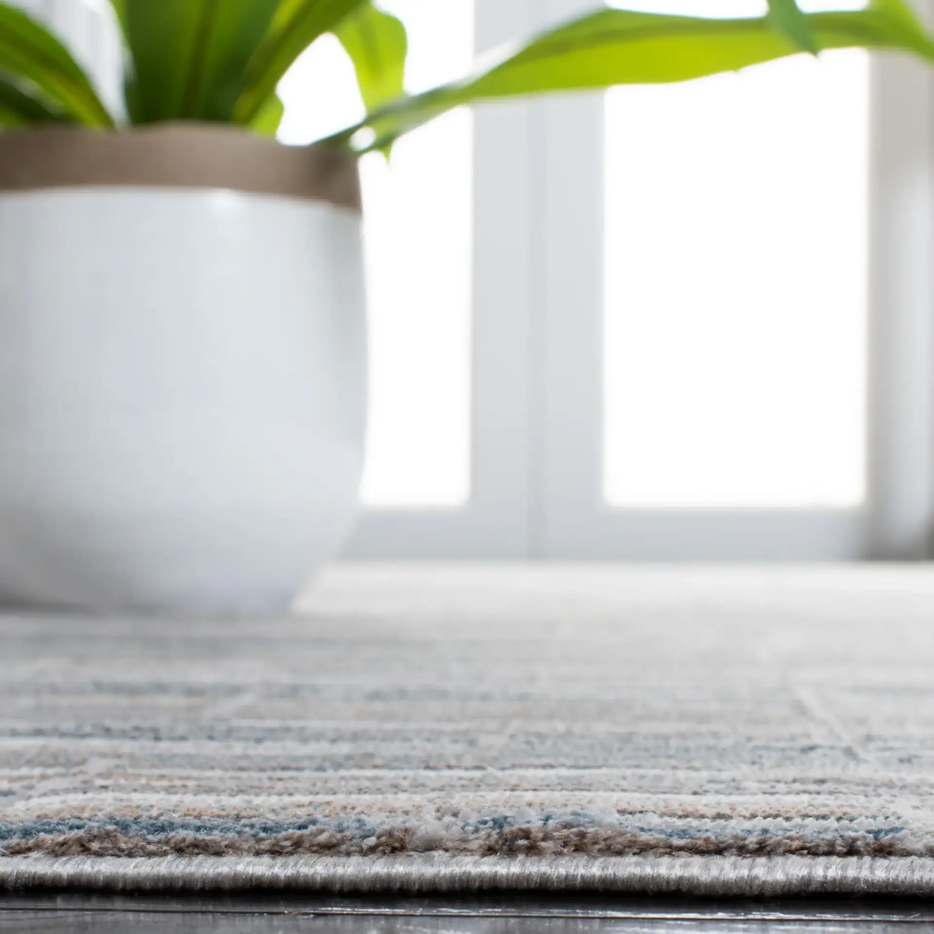 Sonoma Linear Grid Rug in Gray / Ivory in a styled room