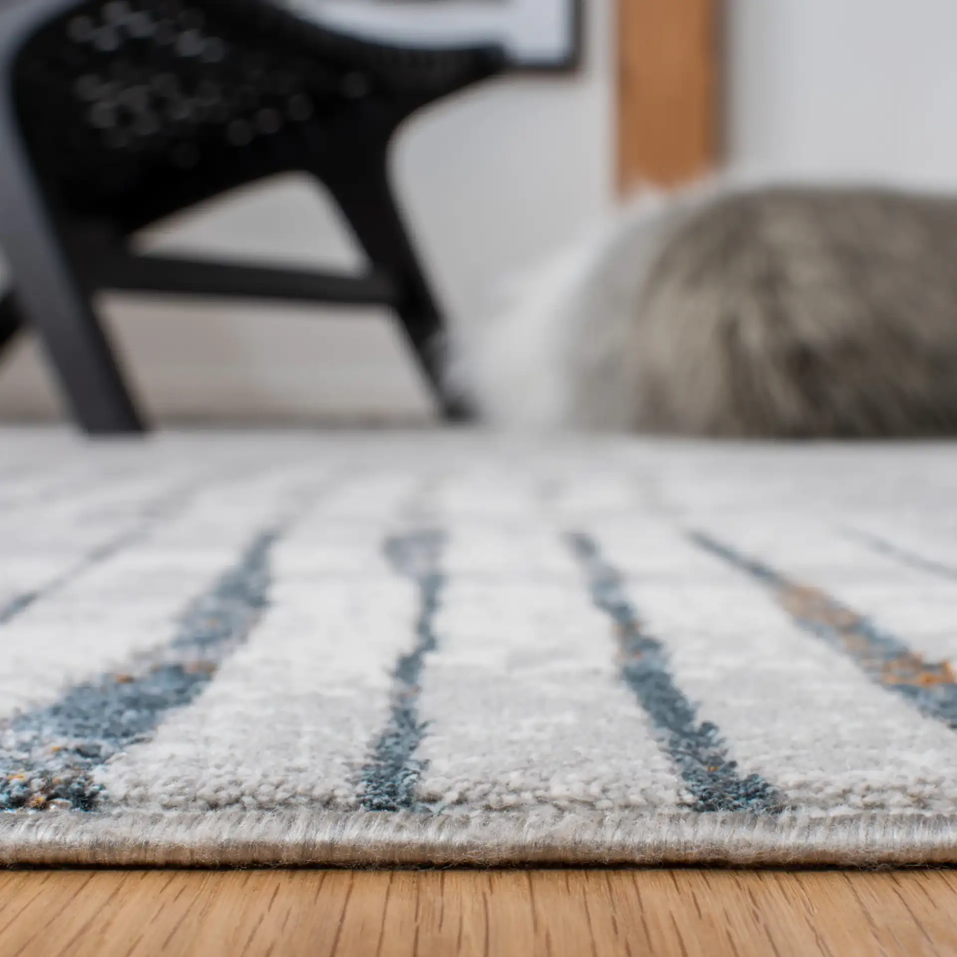 Sonoma Patchwork Grid Rug in Gray / Ivory in a styled room