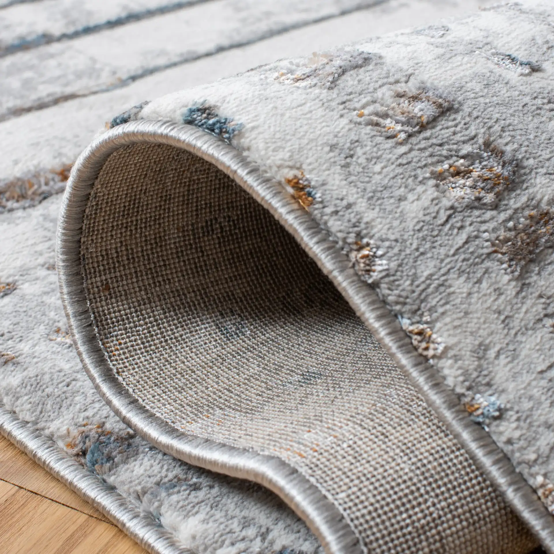 Sonoma Patchwork Grid Rug in Gray / Ivory in a styled room