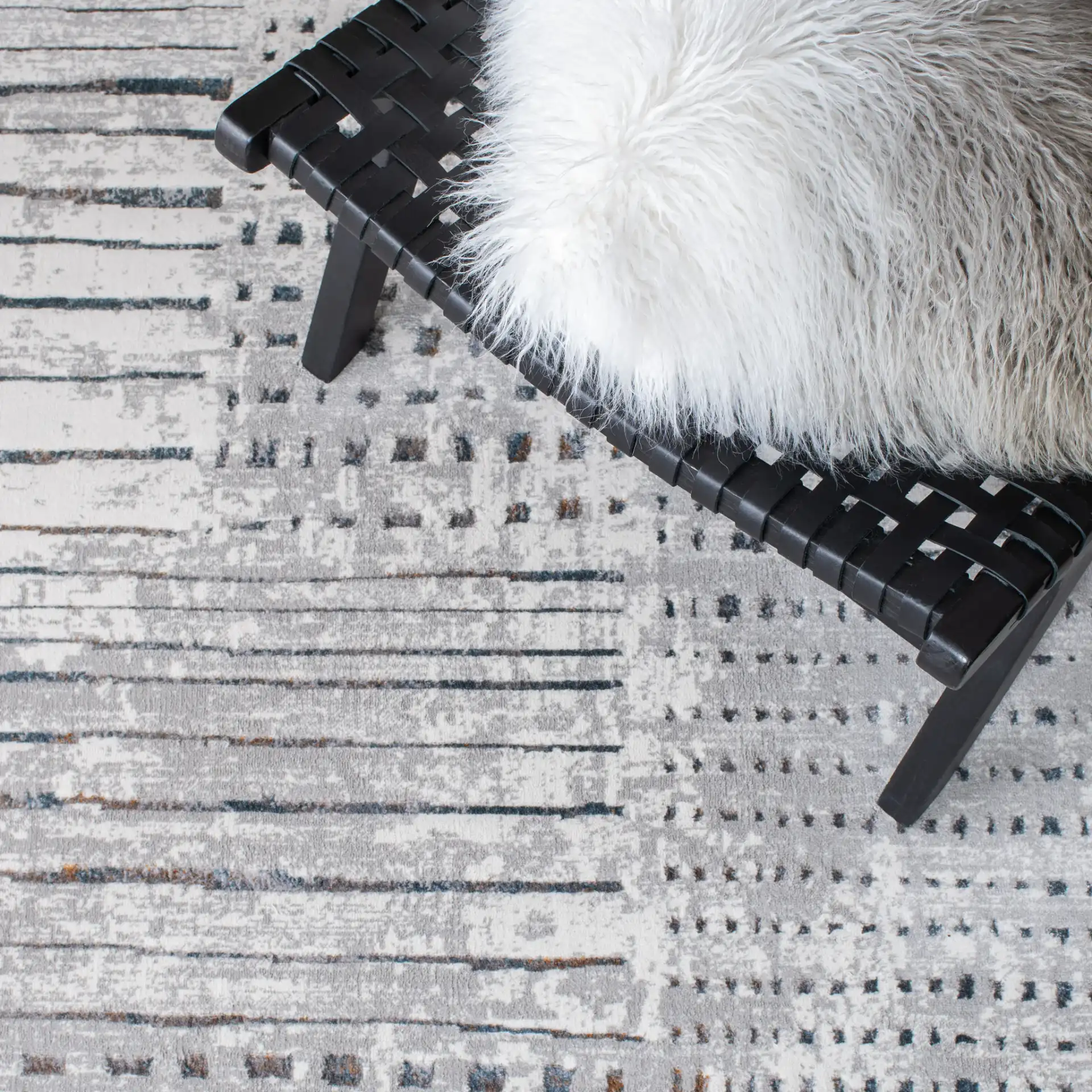Sonoma Patchwork Grid Rug in Gray / Ivory in a styled room