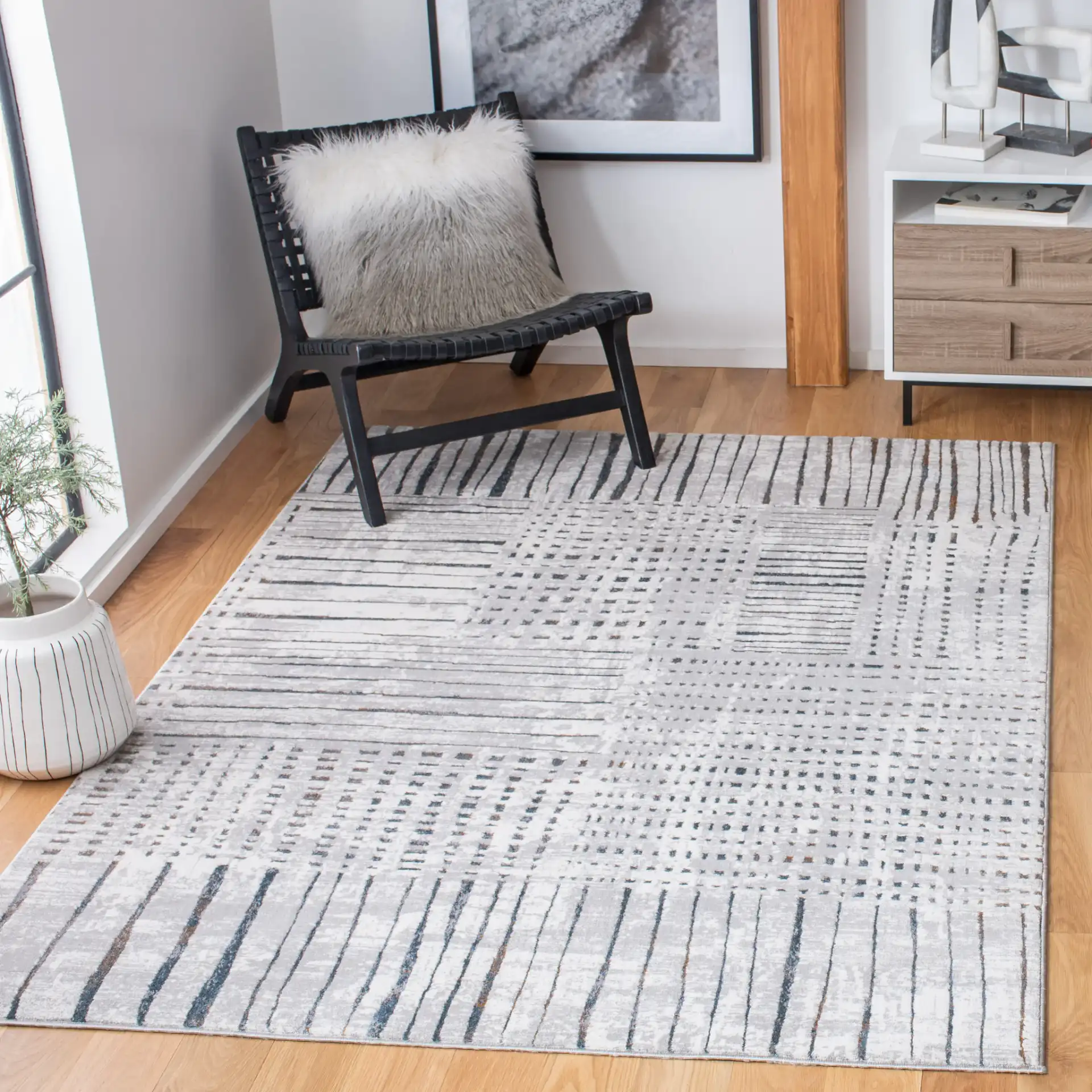 Sonoma Patchwork Grid Rug in Gray / Ivory in a styled room