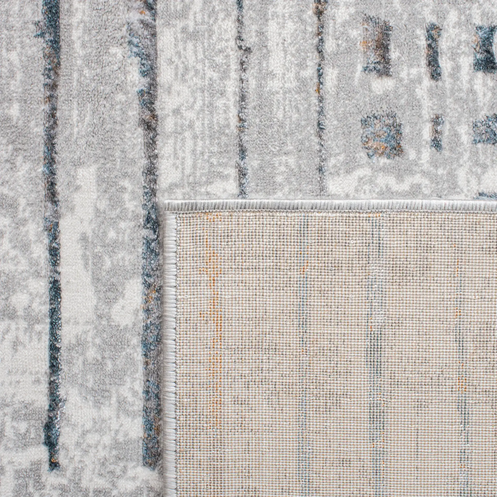 Sonoma Patchwork Grid Rug in Gray / Ivory in a styled room