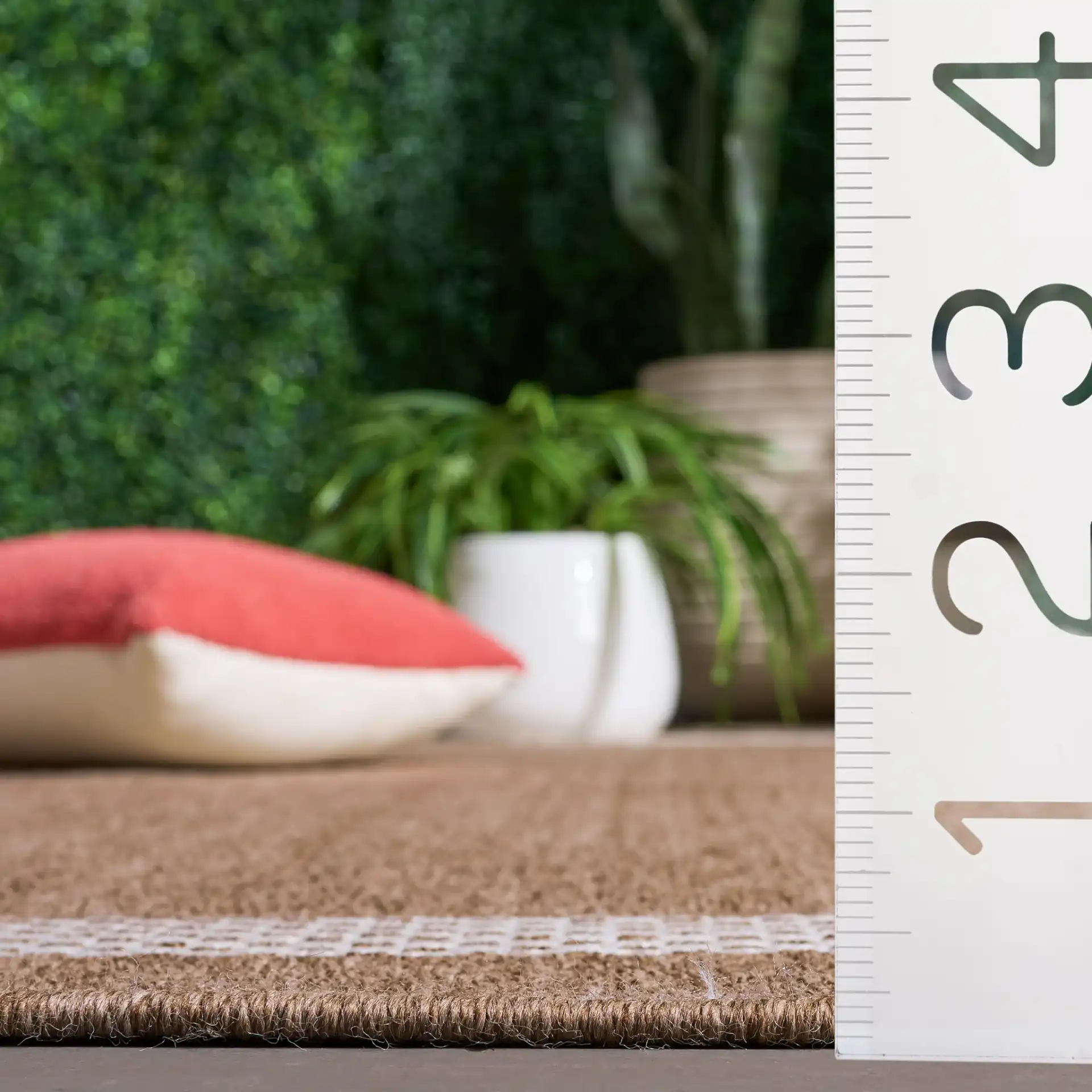 Sisal Performance Tulum Bordered Rug in Natural / Ivory in a styled room