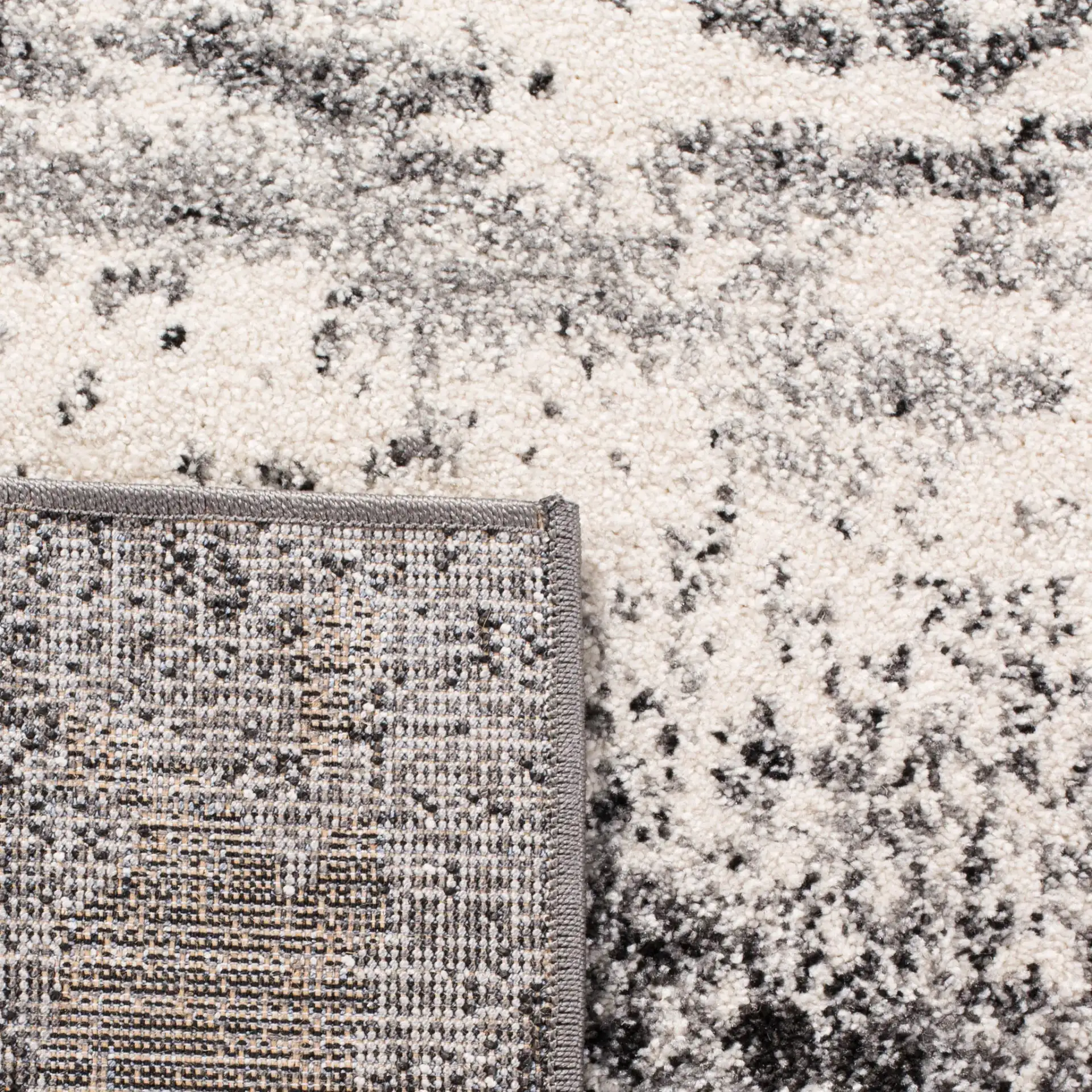 Spirit Abstract Banded Rug in Charcoal / Light Gray in a styled room