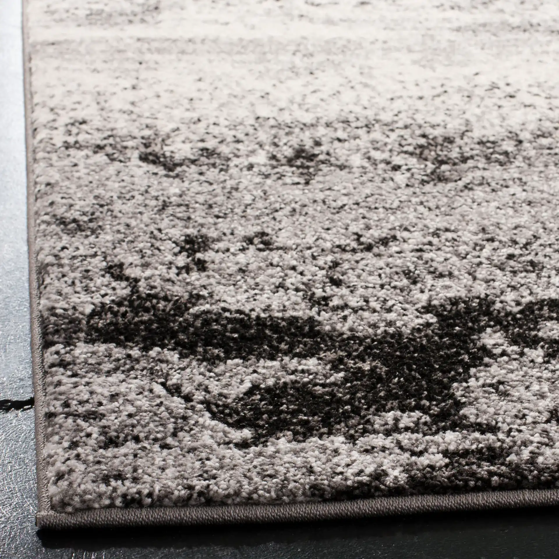 Spirit Abstract Banded Rug in Charcoal / Light Gray in a styled room