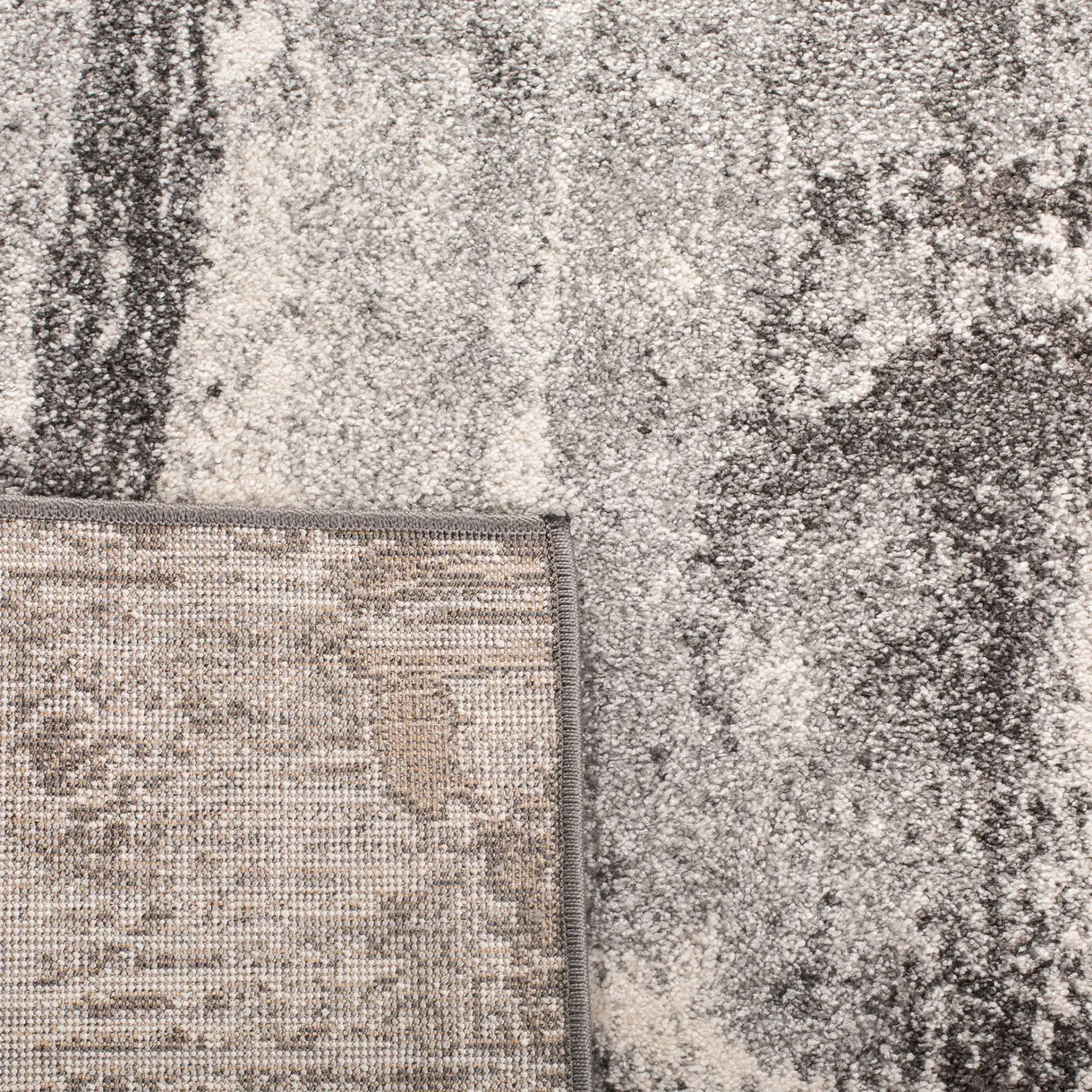 Spirit Modern Abstract Rug in Dark Gray / Ivory in a styled room
