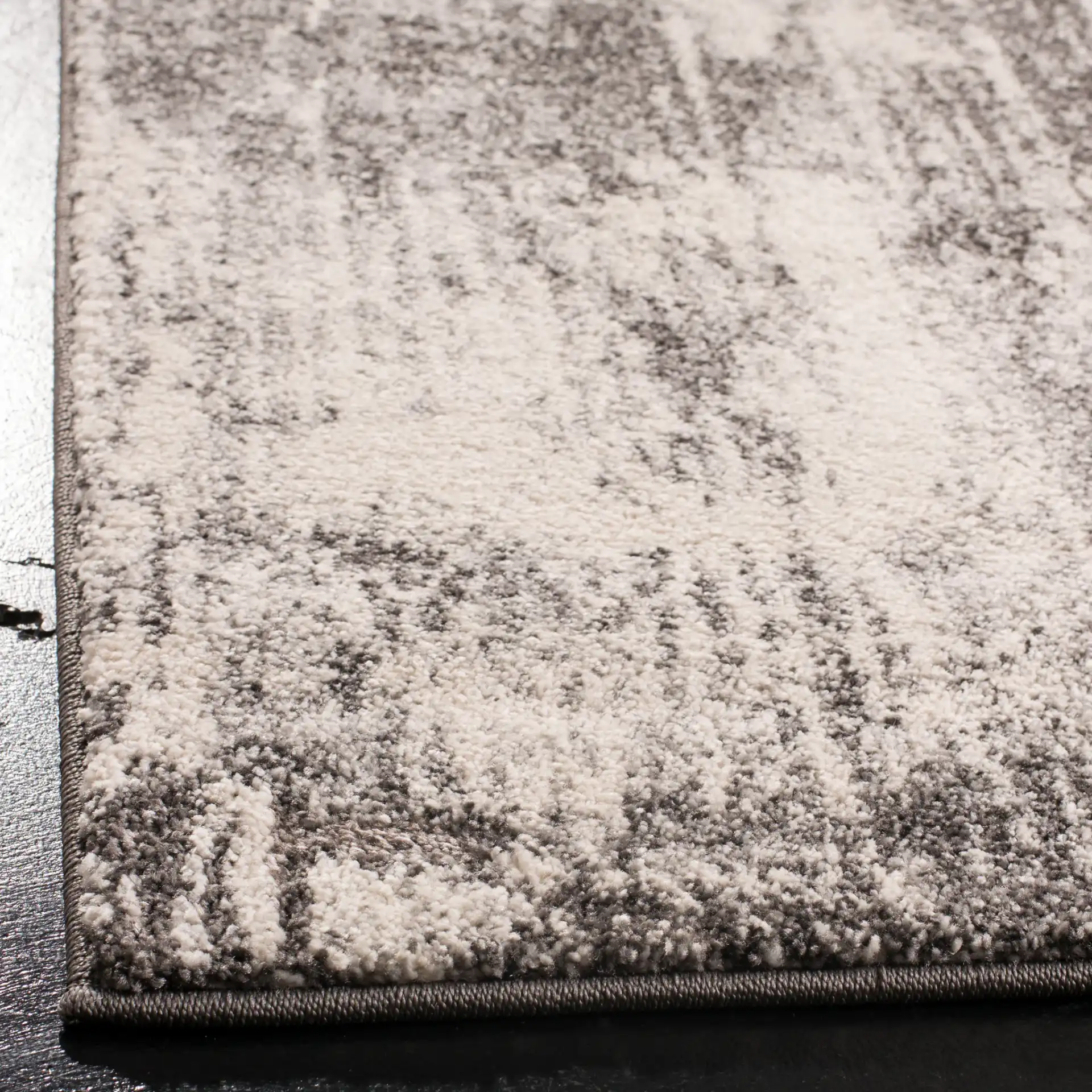 Spirit Modern Abstract Rug in Dark Gray / Ivory in a styled room