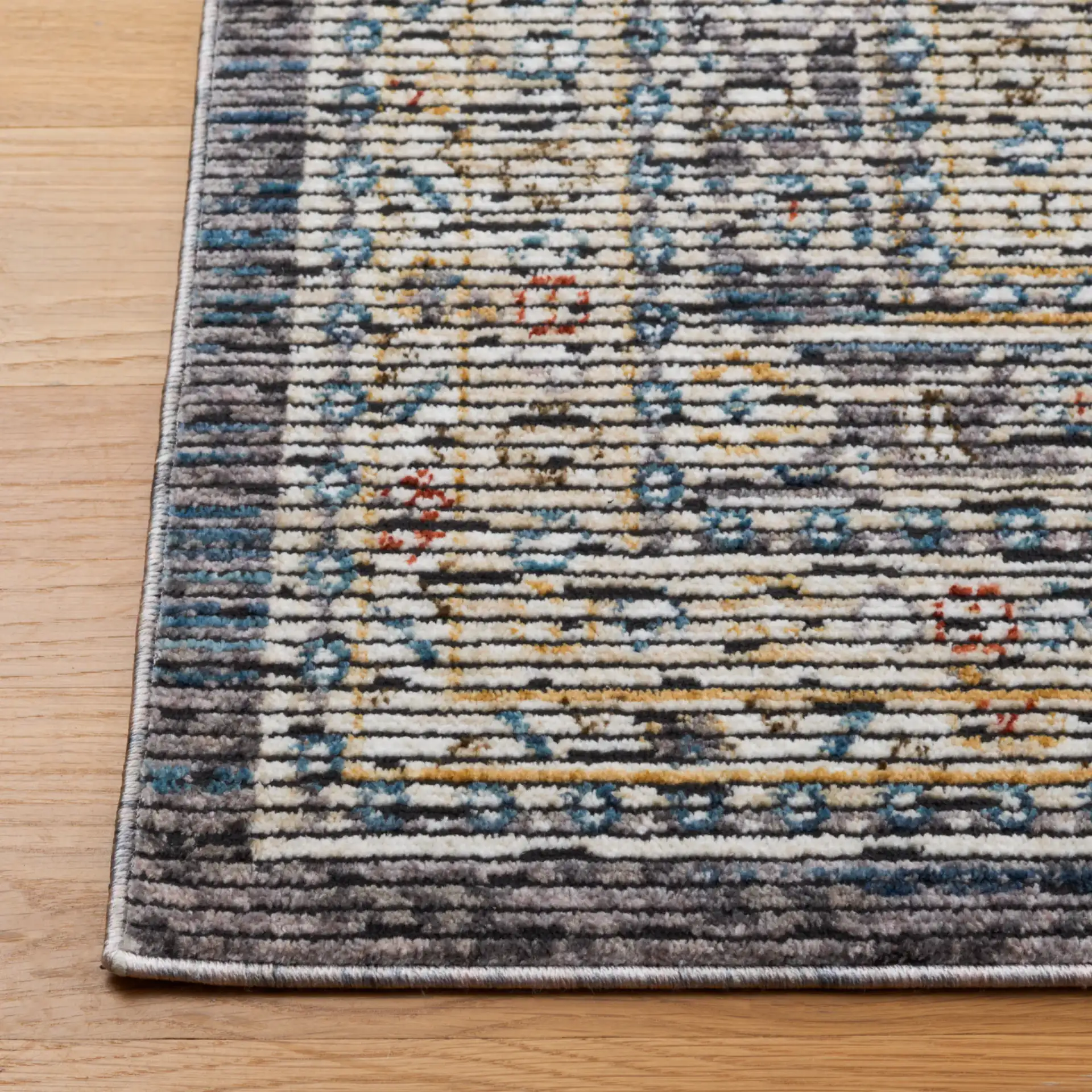 Sierra Medallion Bordered Rug in Ivory / Gray in a styled room