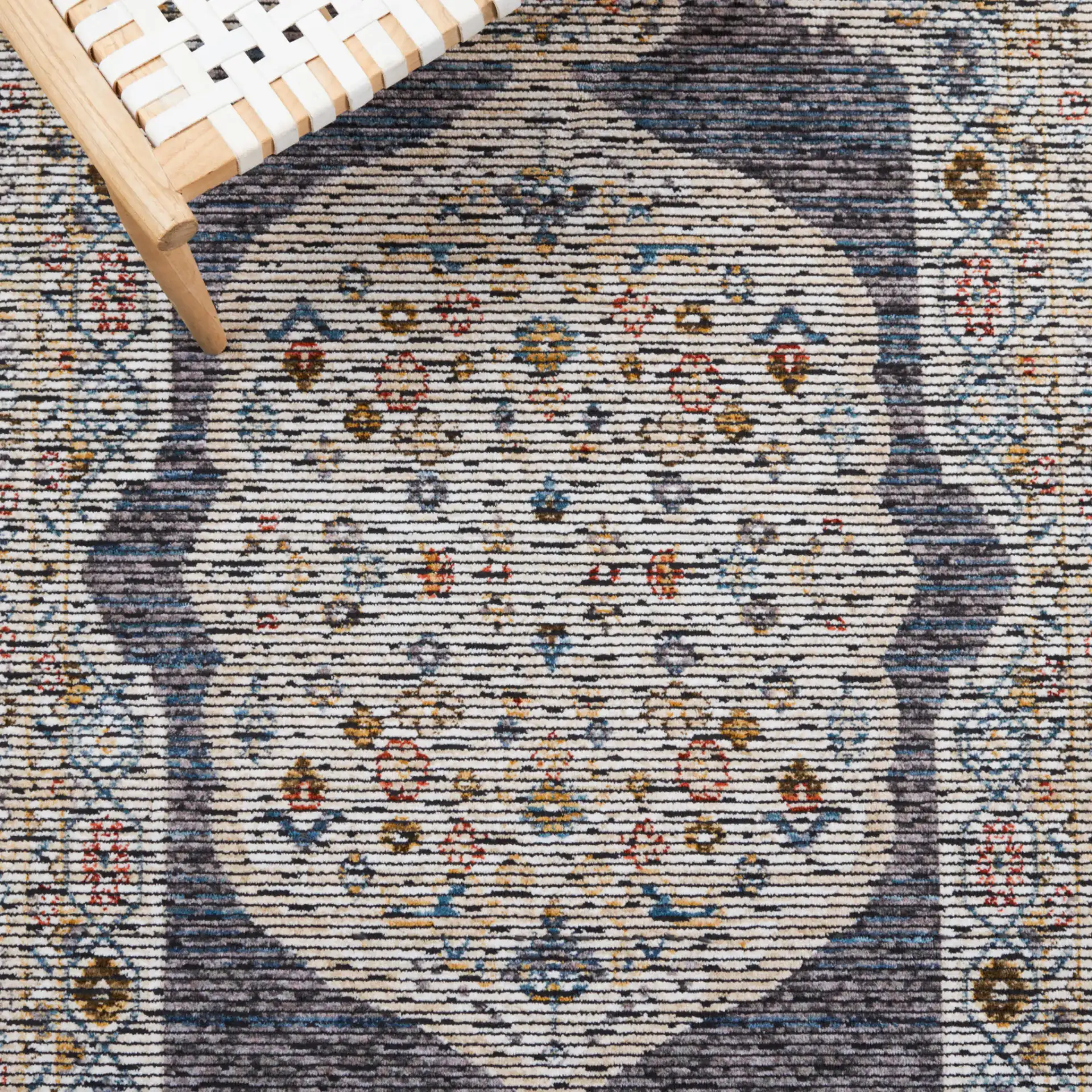 Sierra Medallion Bordered Rug in Ivory / Gray in a styled room