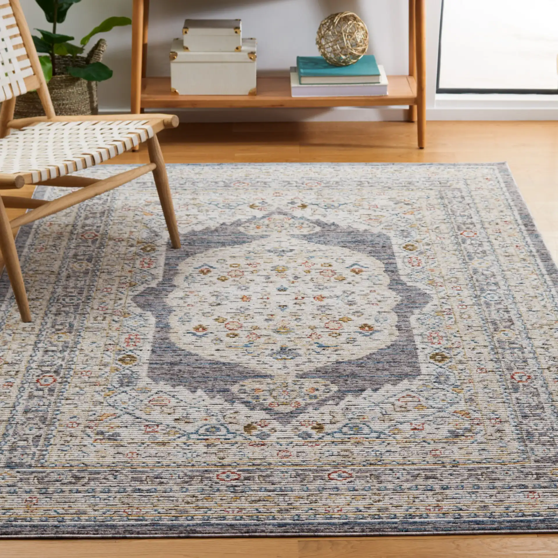 Sierra Medallion Bordered Rug in Ivory / Gray in a styled room