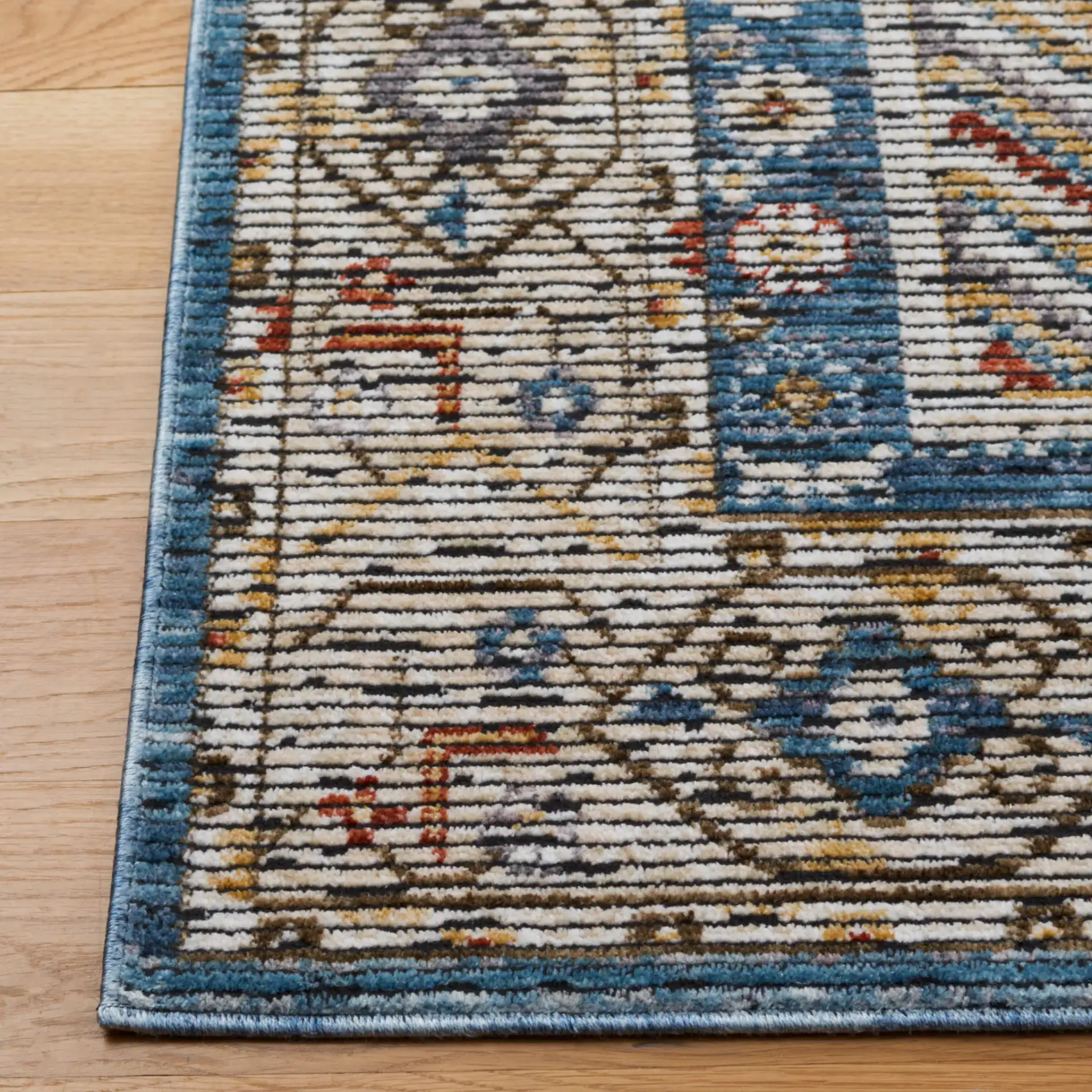 Sierra Geometric Panel Rug in Ivory / Blue in a styled room