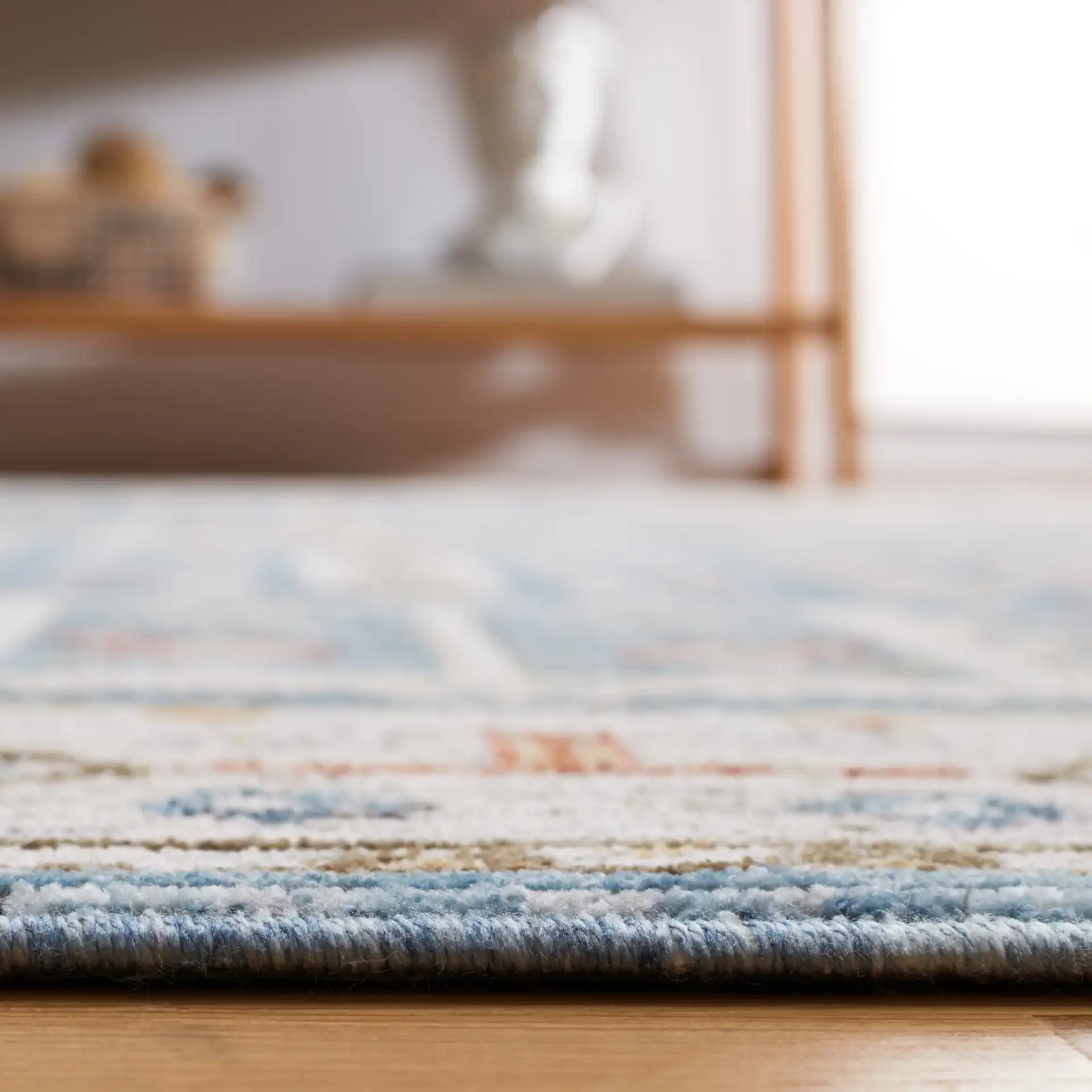Sierra Geometric Panel Rug in Ivory / Blue in a styled room