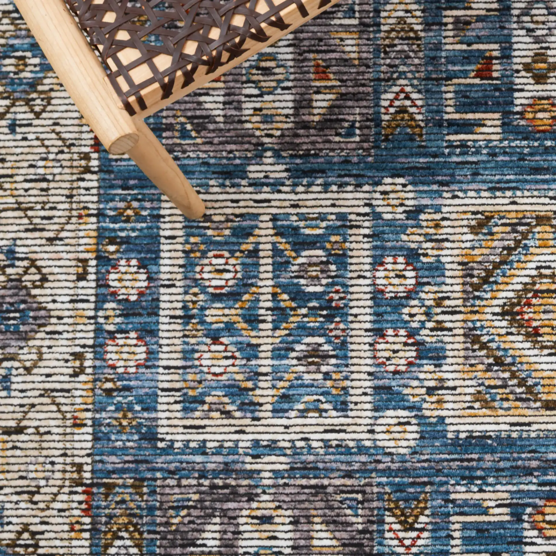 Sierra Geometric Panel Rug in Ivory / Blue in a styled room