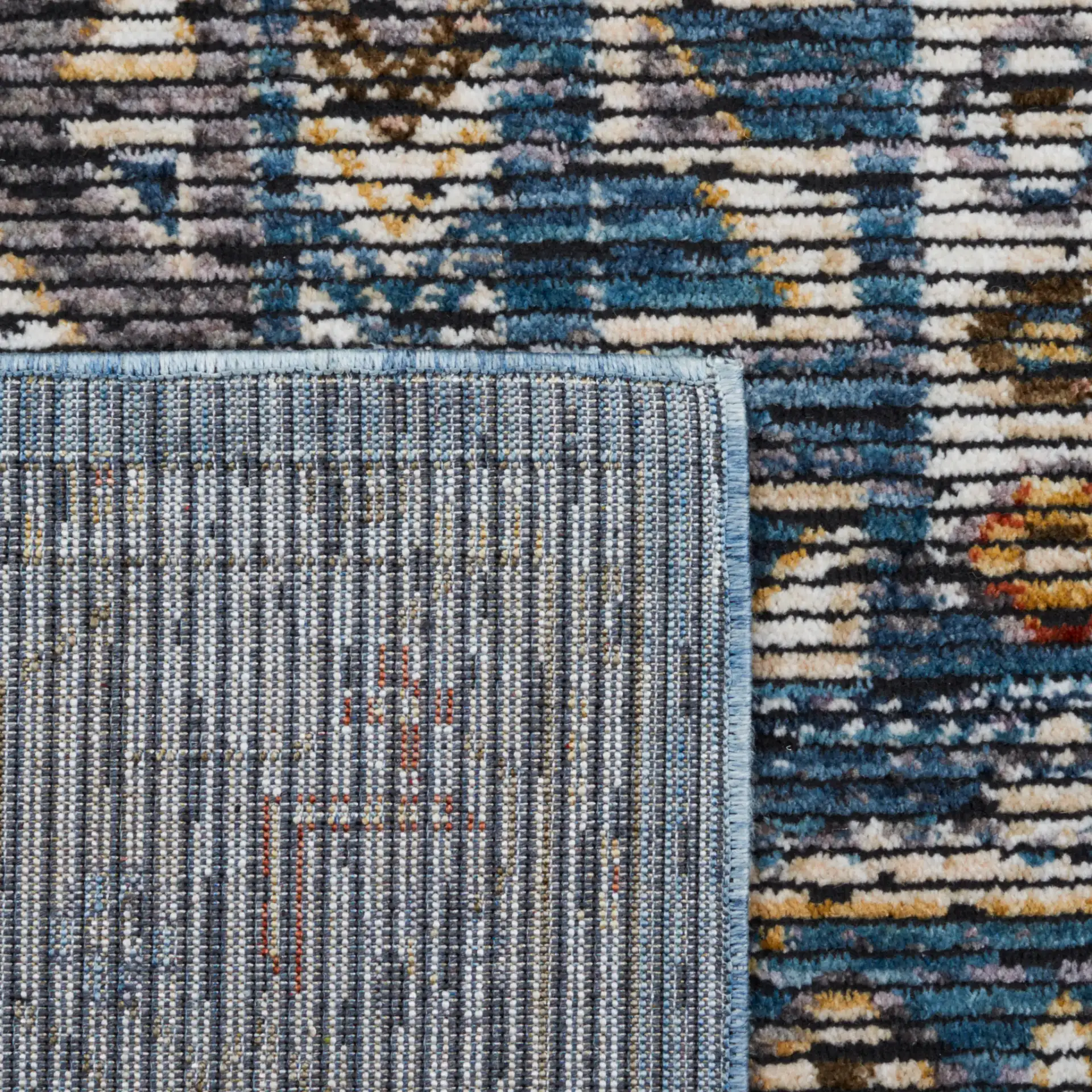 Sierra Geometric Panel Rug in Ivory / Blue in a styled room