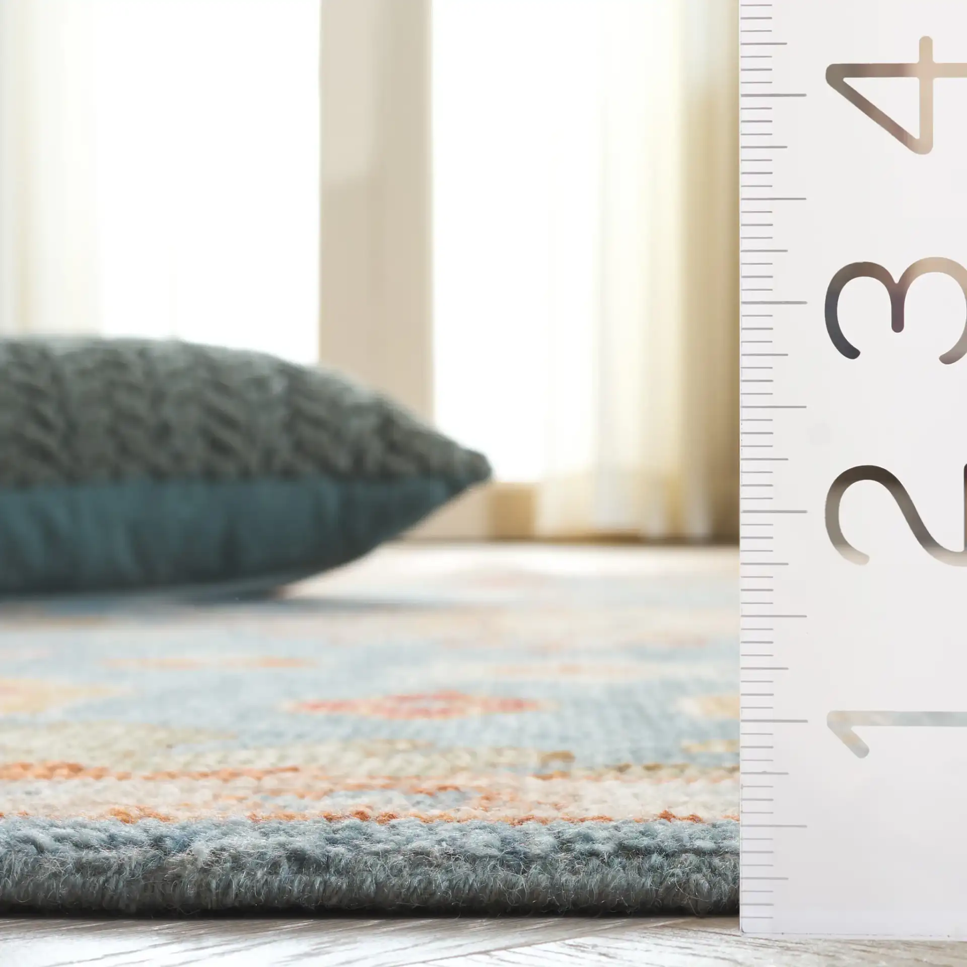 Samarkand Palmette Floral Bordered Hand-Knotted Wool Rug in Blue in a styled room