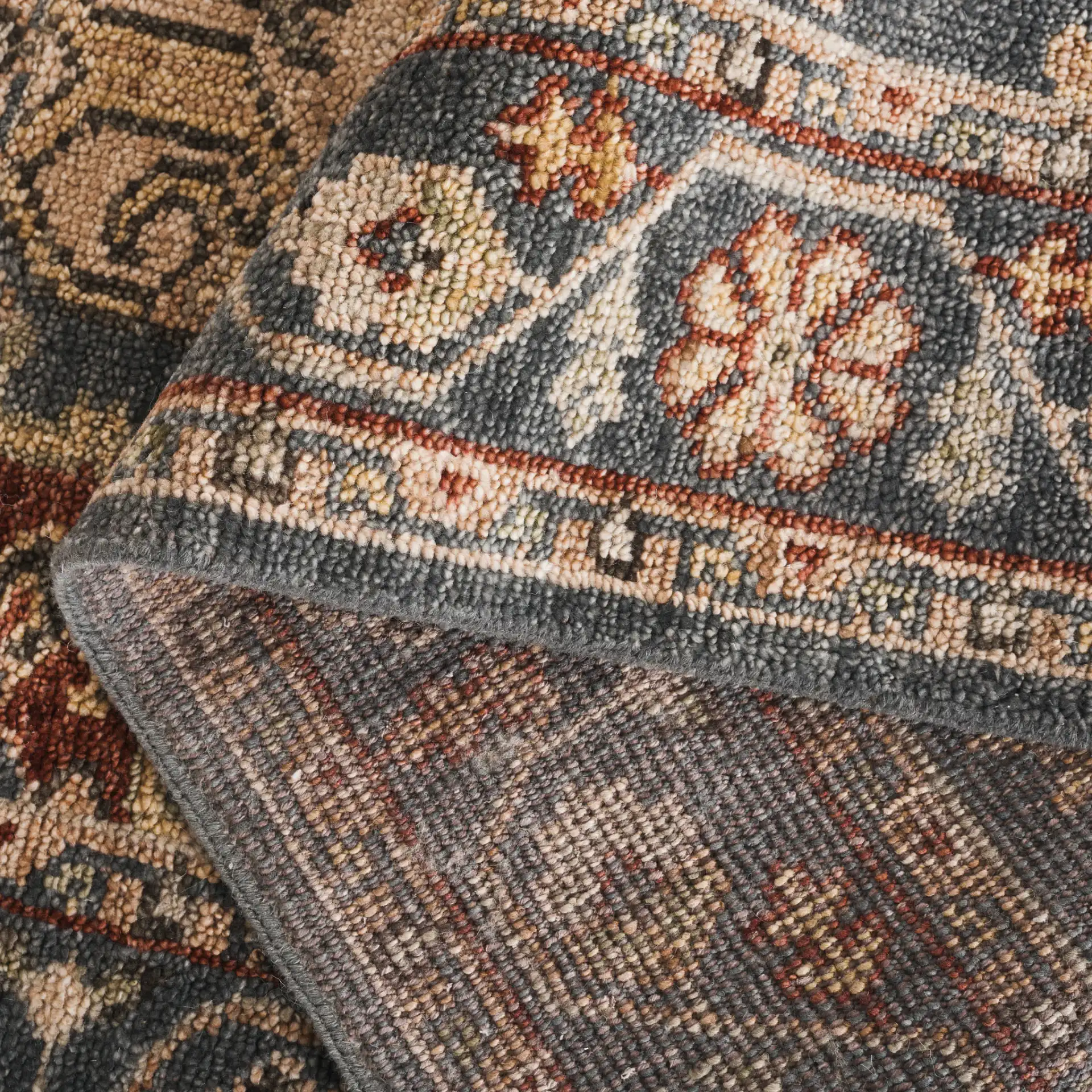 Samarkand Stepped Medallion Hand-Knotted Wool Rug in Blue / Ivory in a styled room