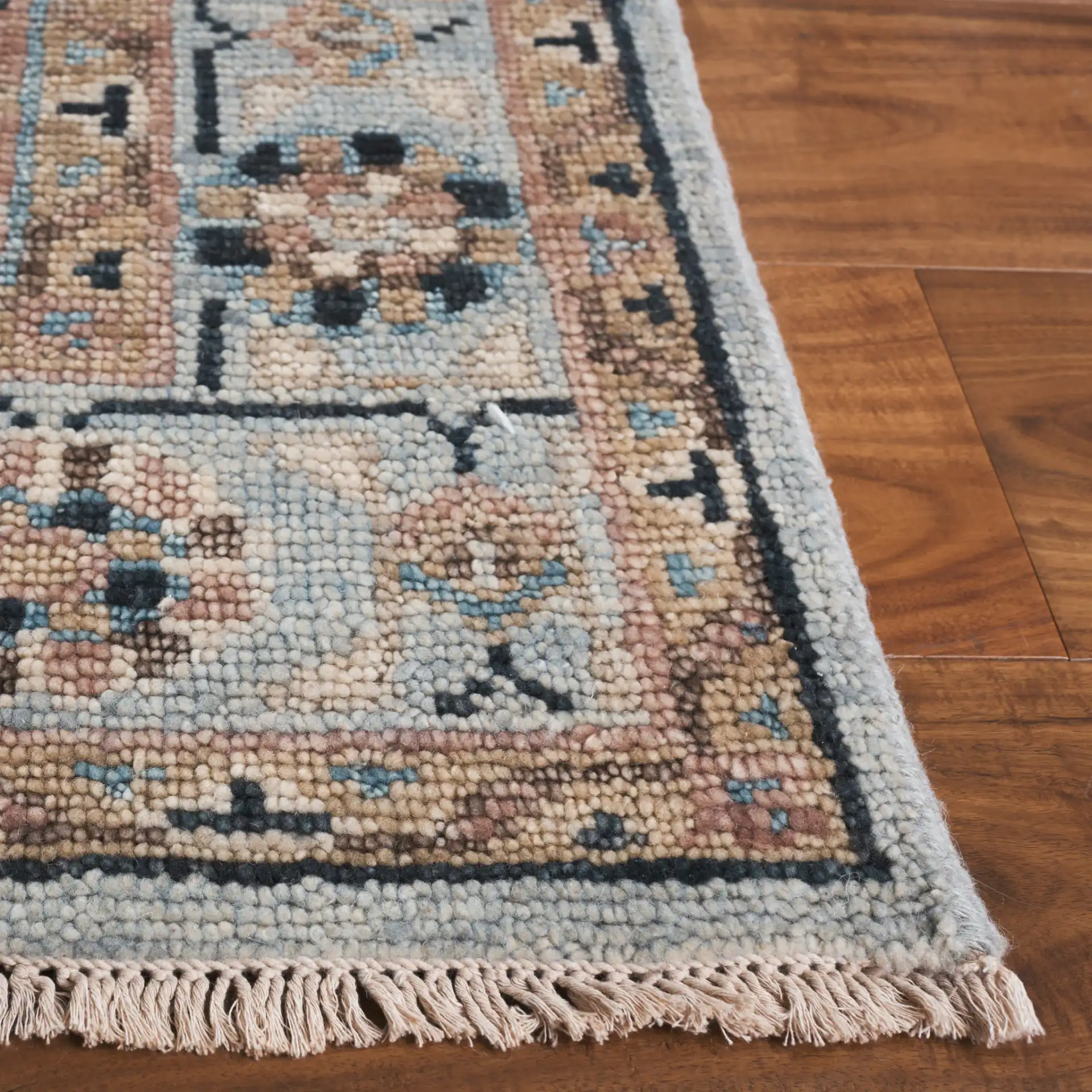 Samarkand Tribal Medallion Bordered Hand-Knotted Wool Rug in Light Blue / Beige in a styled room