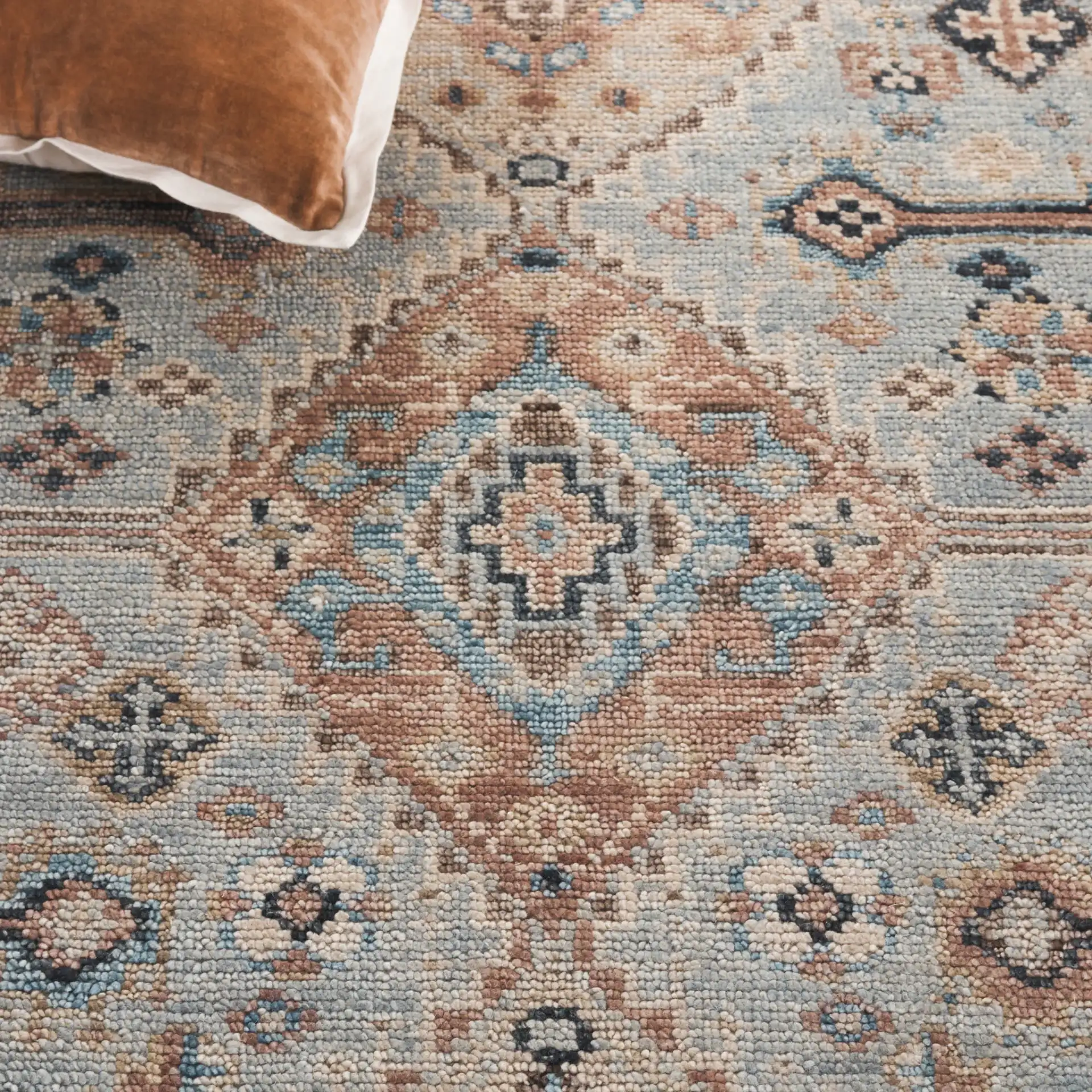 Samarkand Tribal Medallion Bordered Hand-Knotted Wool Rug in Light Blue / Beige in a styled room