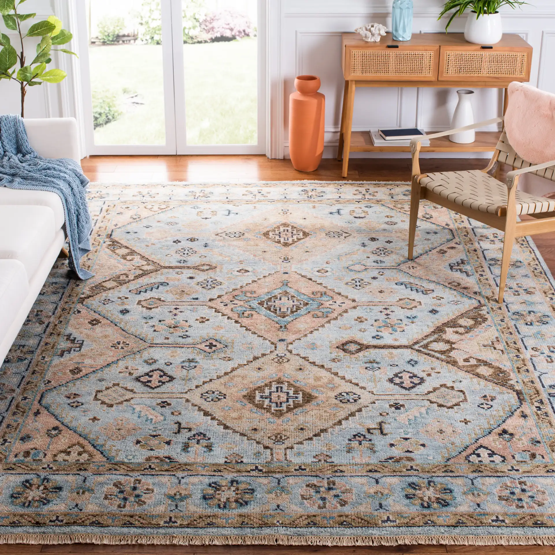 Samarkand Tribal Medallion Bordered Hand-Knotted Wool Rug in Light Blue / Beige in a styled room