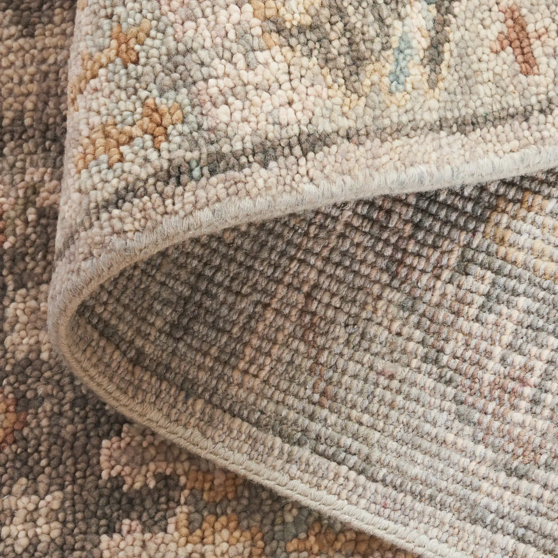 Samarkand Faded Tribal Medallion Hand-Knotted Wool Rug in Gray / Ivory in a styled room