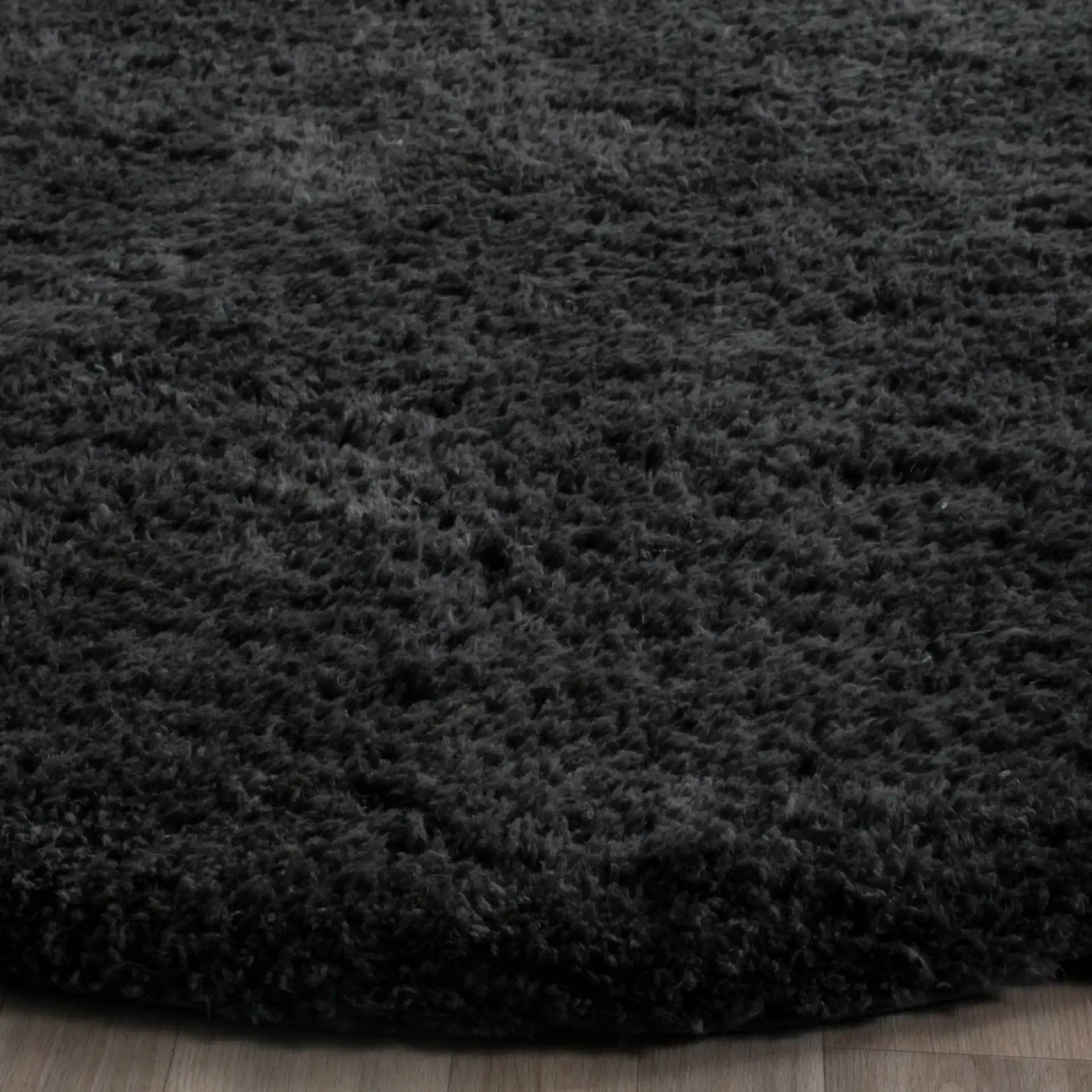 Sheep Hand-Woven Pelt Shag Rug in Charcoal in a styled room