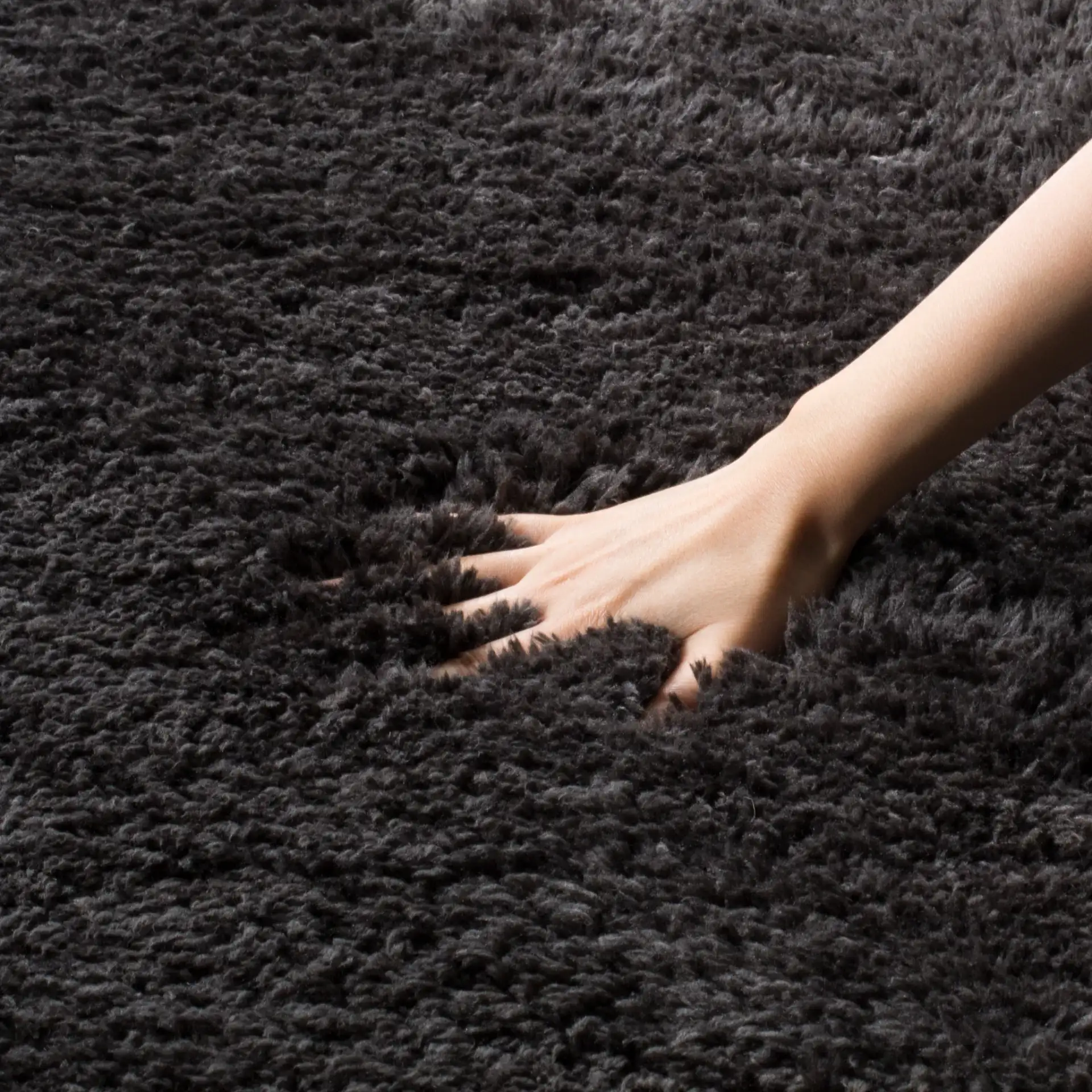 Sheep Solid Hand-Woven Shag Rug in Charcoal, detail view